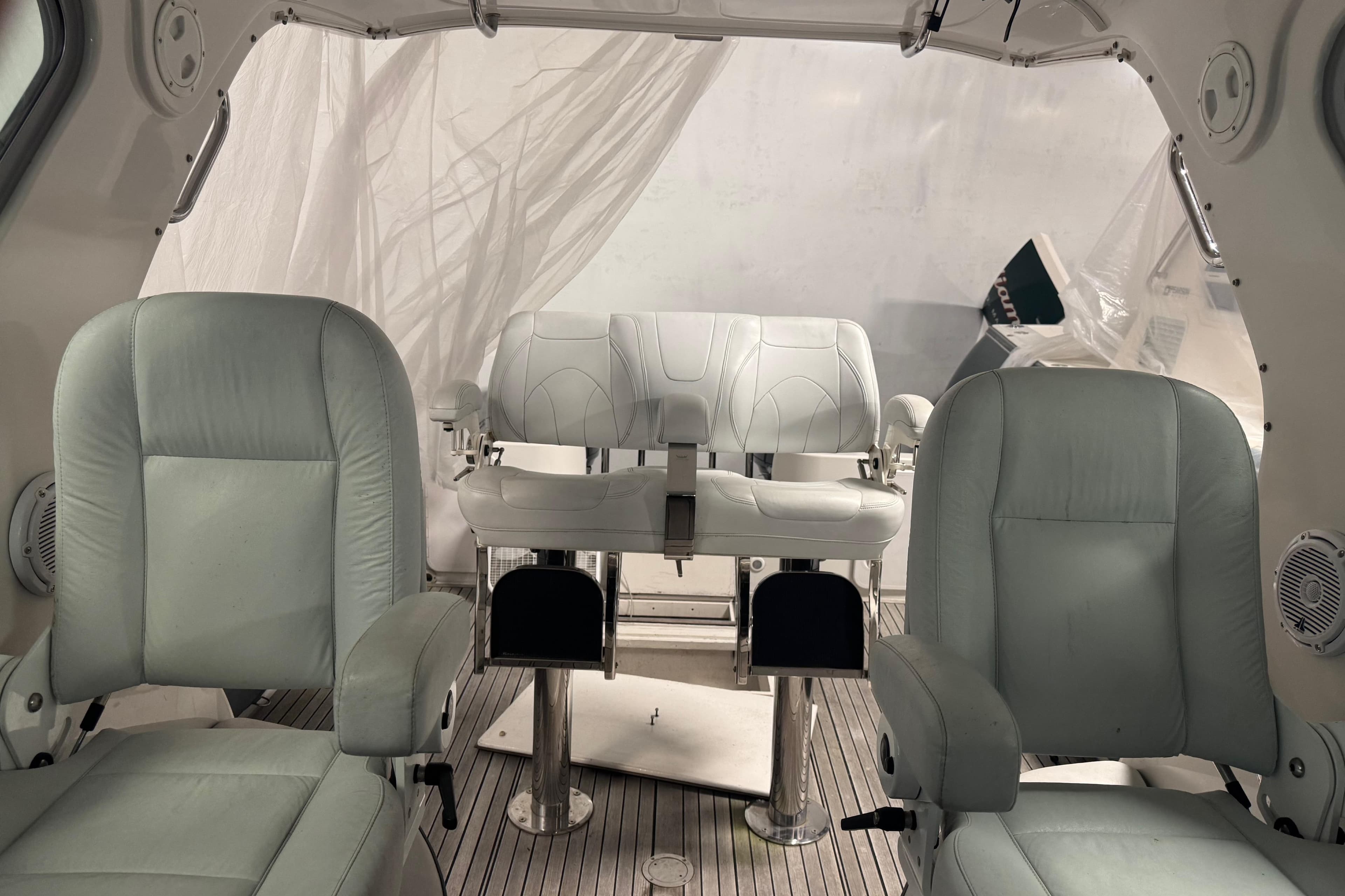 Interior of 2016 Protector Tauranga 41 boat with white leather seating.