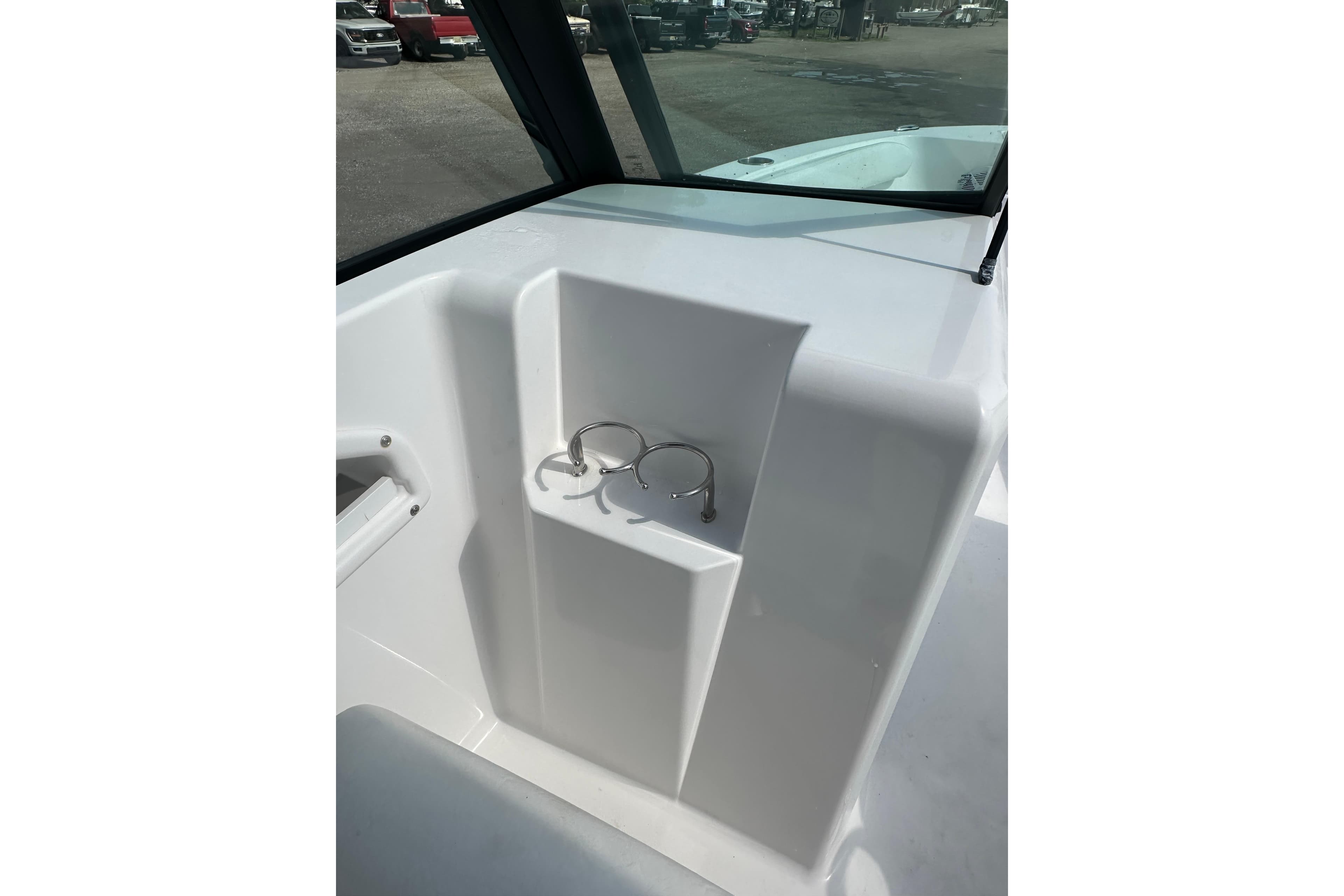 2024 Aquasport 2200 Dual Console boat interior with cup holders.