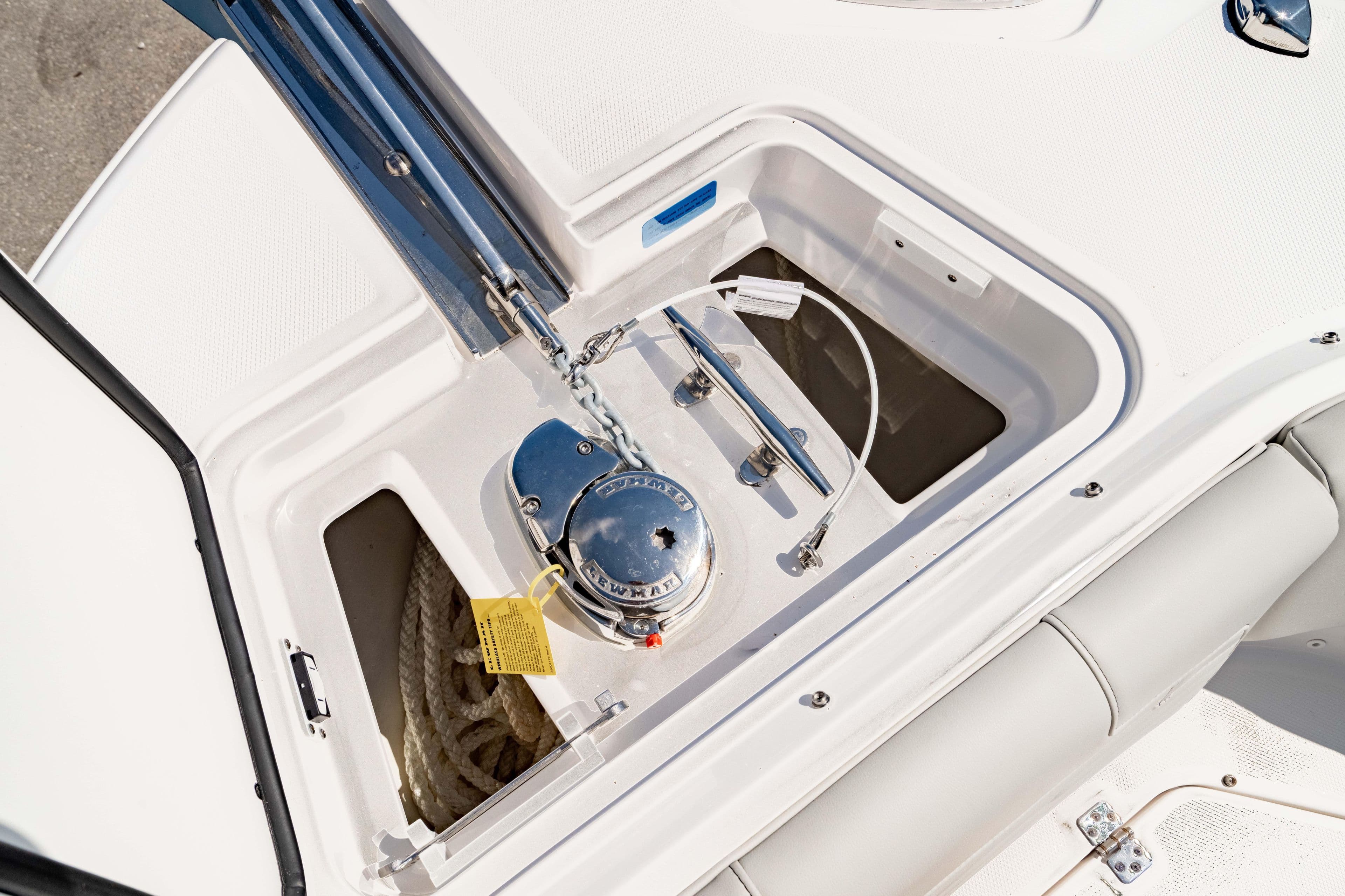 Anchor compartment of 2026 Edgewater 262CX Crossover boat with rope and winch.