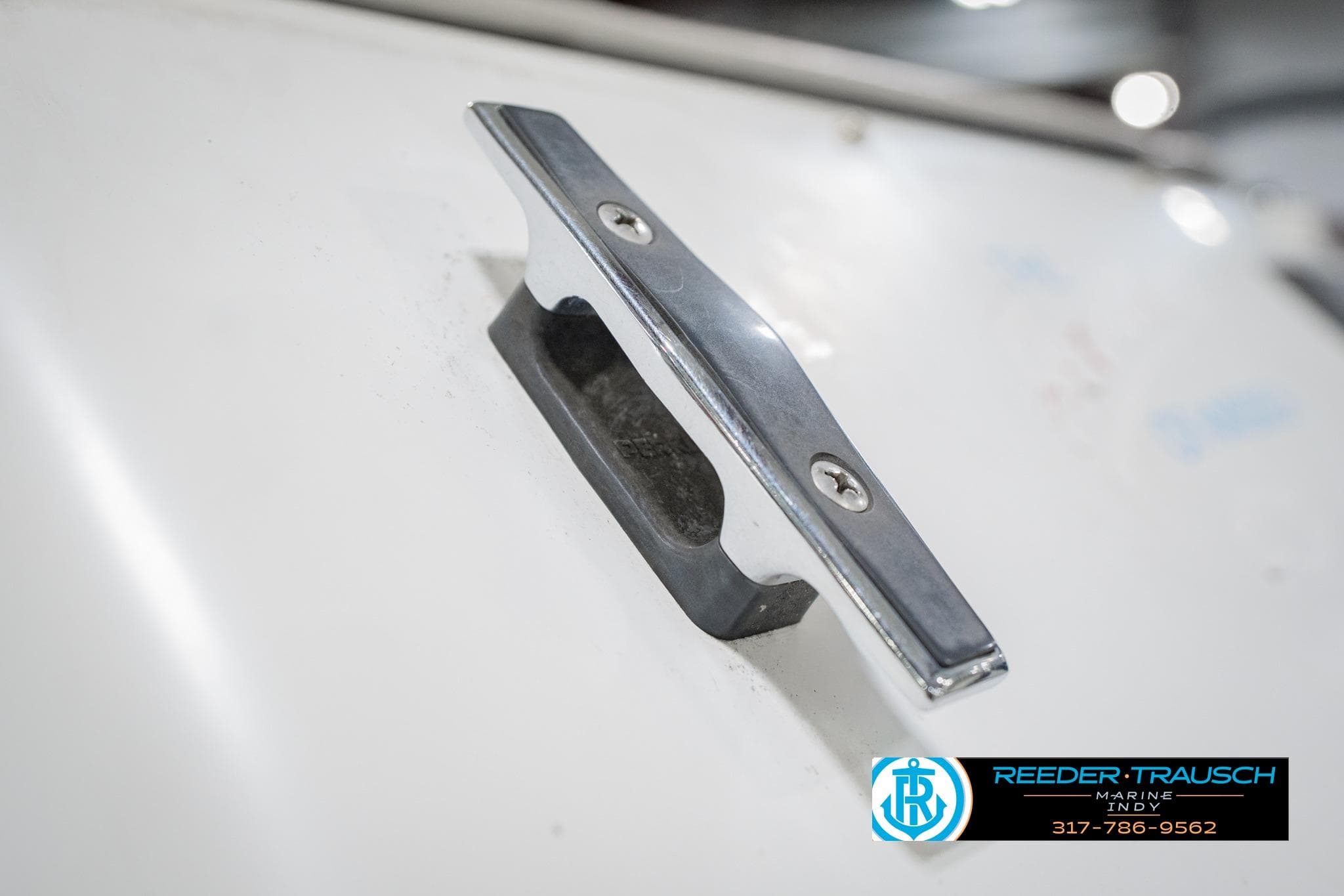 Chrome cleat on 1986 Regal Sebring 195 boat deck.