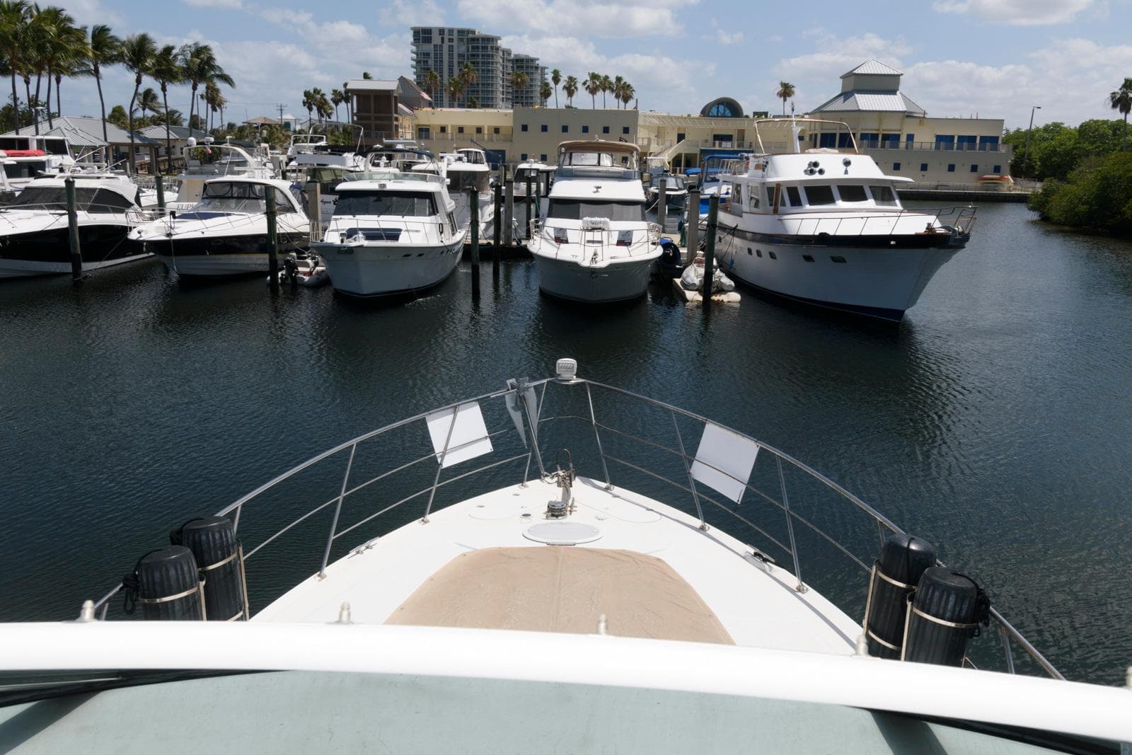 Bow view of 1999 Carver 450 Voyager Pilothouse docked at marina.