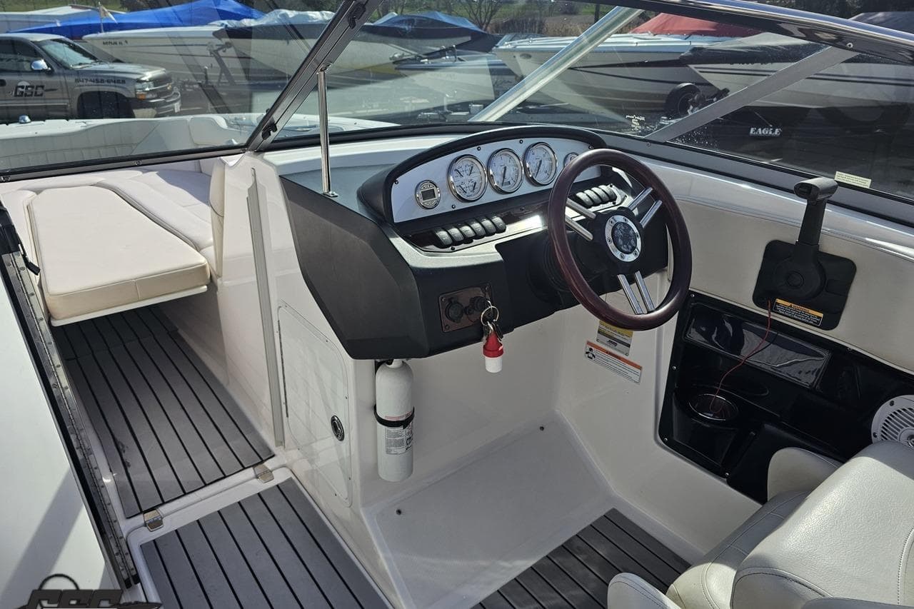 2008 Regal 2520 FasDeck boat interior with steering wheel and dashboard controls.