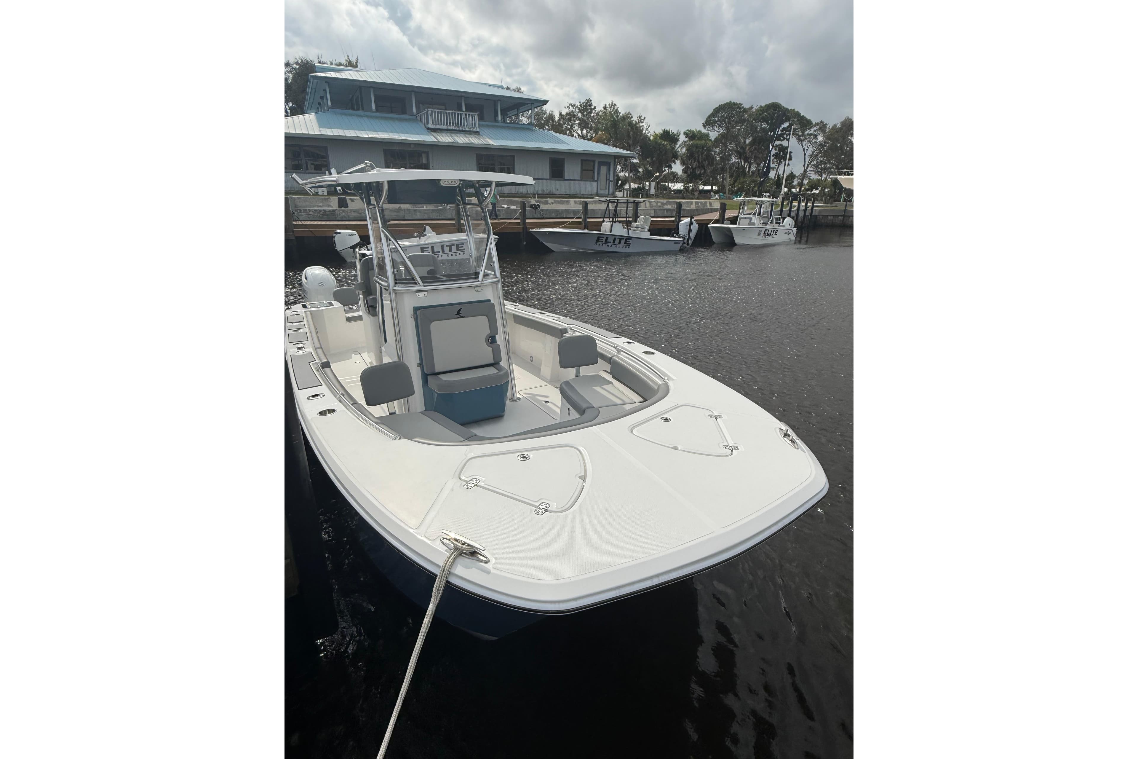 2026 Falcon Boats 26 docked, featuring sleek design and spacious deck.