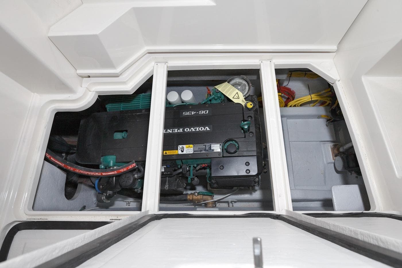 Engine compartment of 2026 Aspen C128 Flybridge, featuring a Volvo Penta engine.