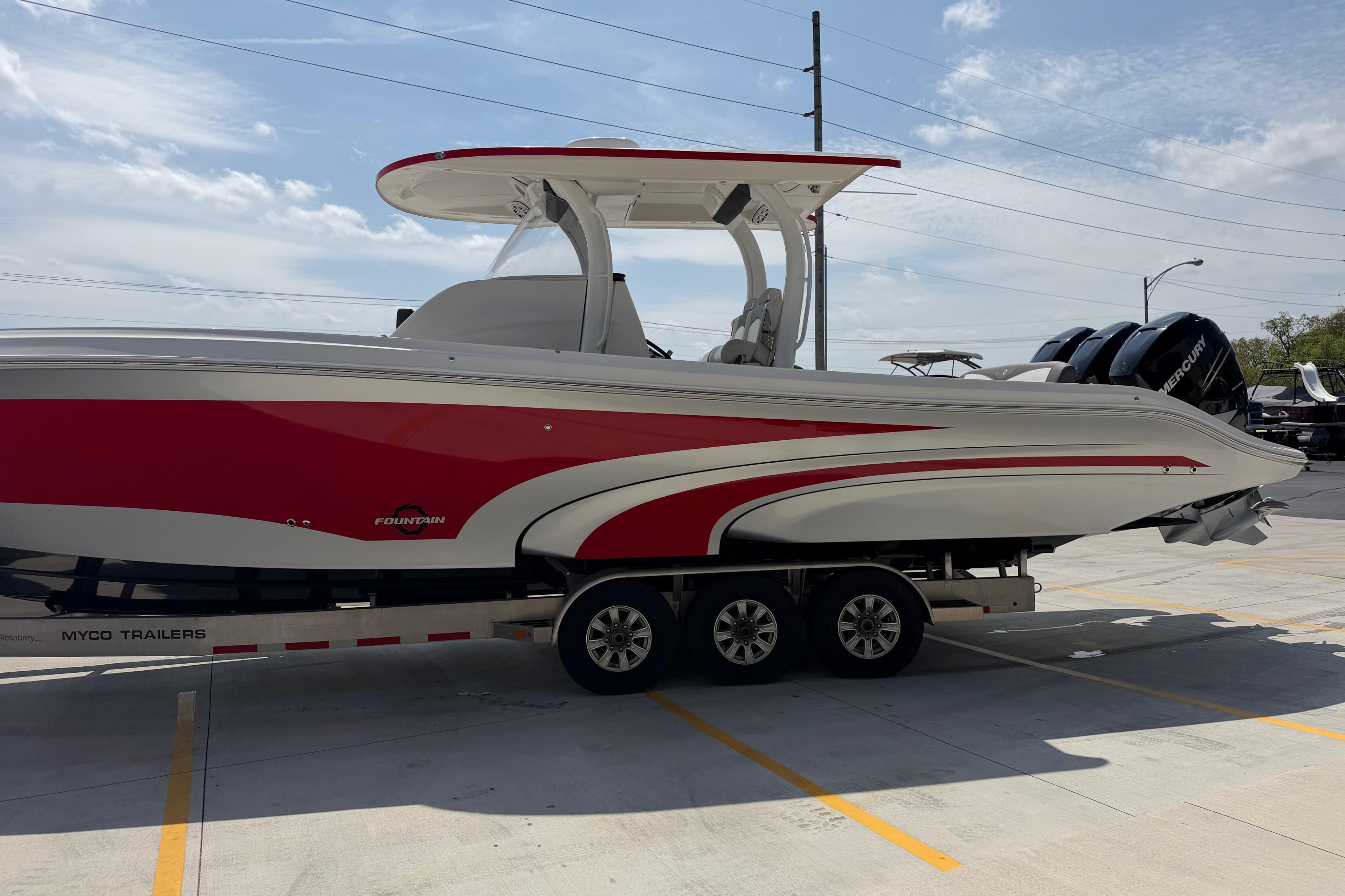 2018 Fountain 39 NX boat with red and white design on a trailer.