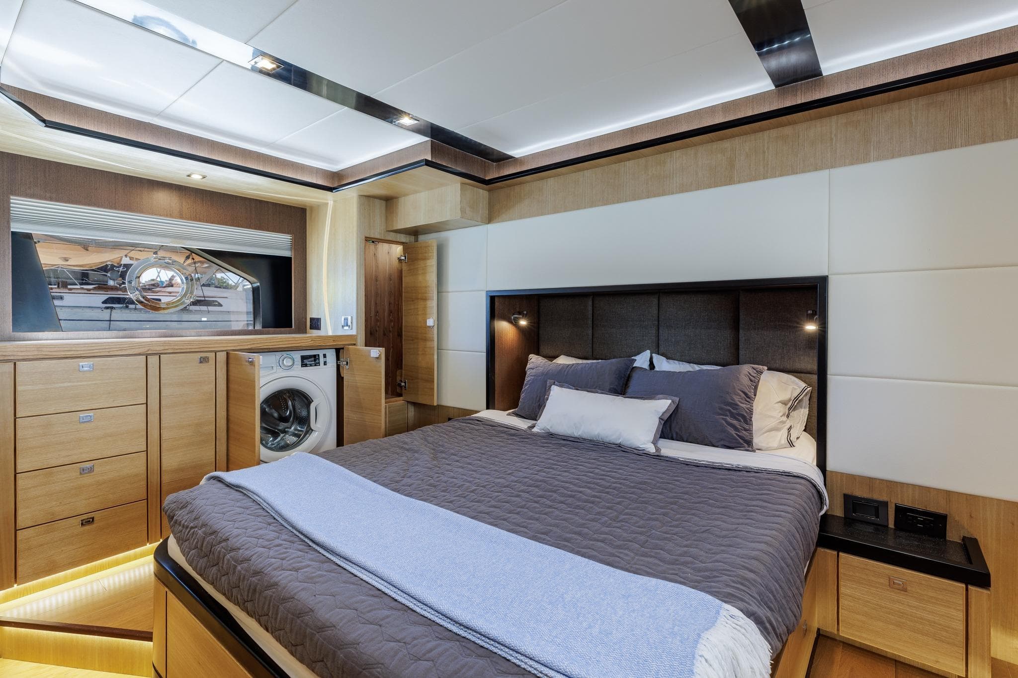 Luxurious bedroom interior of 2023 North Pacific 49 Euro yacht with modern amenities.