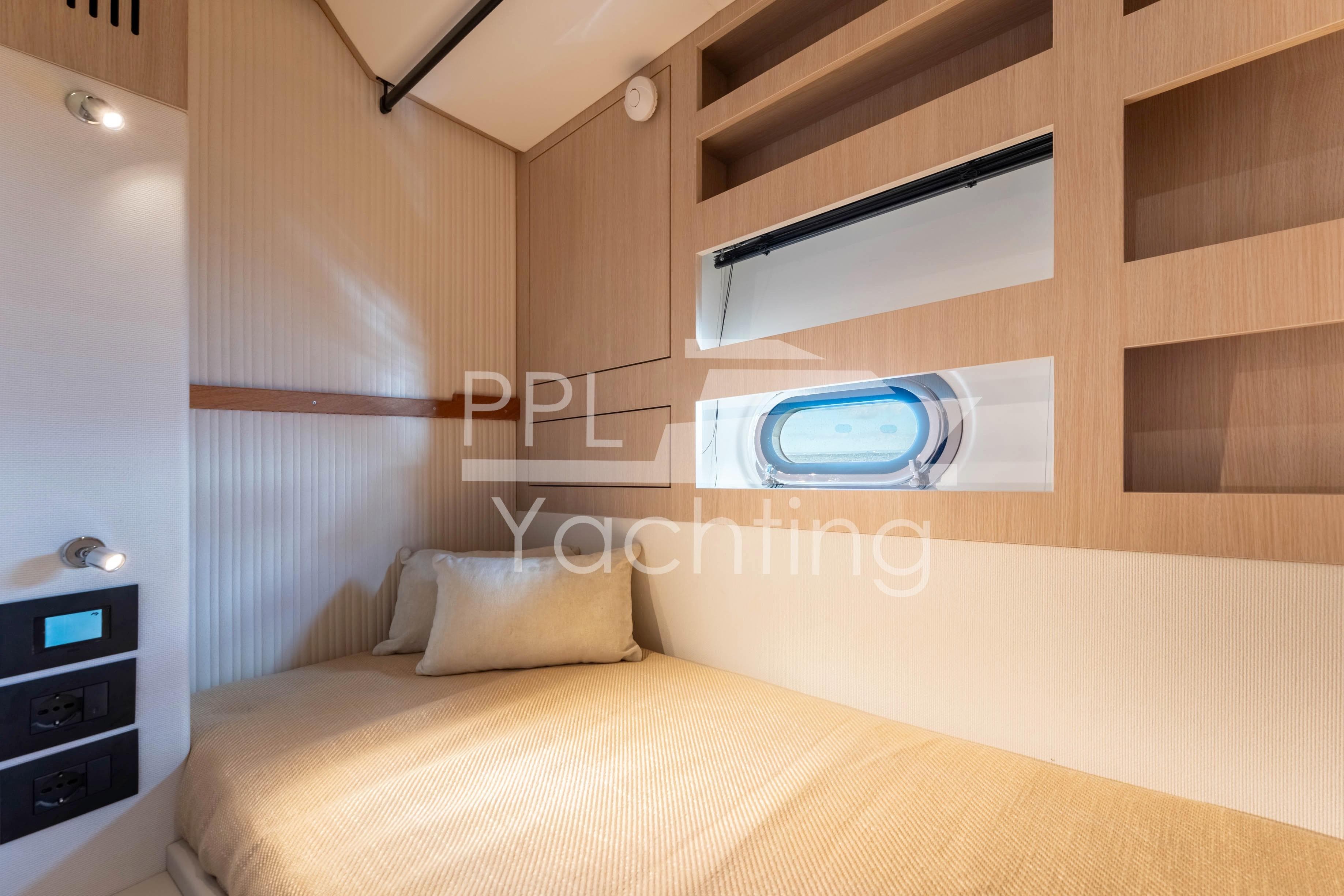 Cozy cabin interior of 2021 Azimut Magellano 66 yacht with modern design elements.