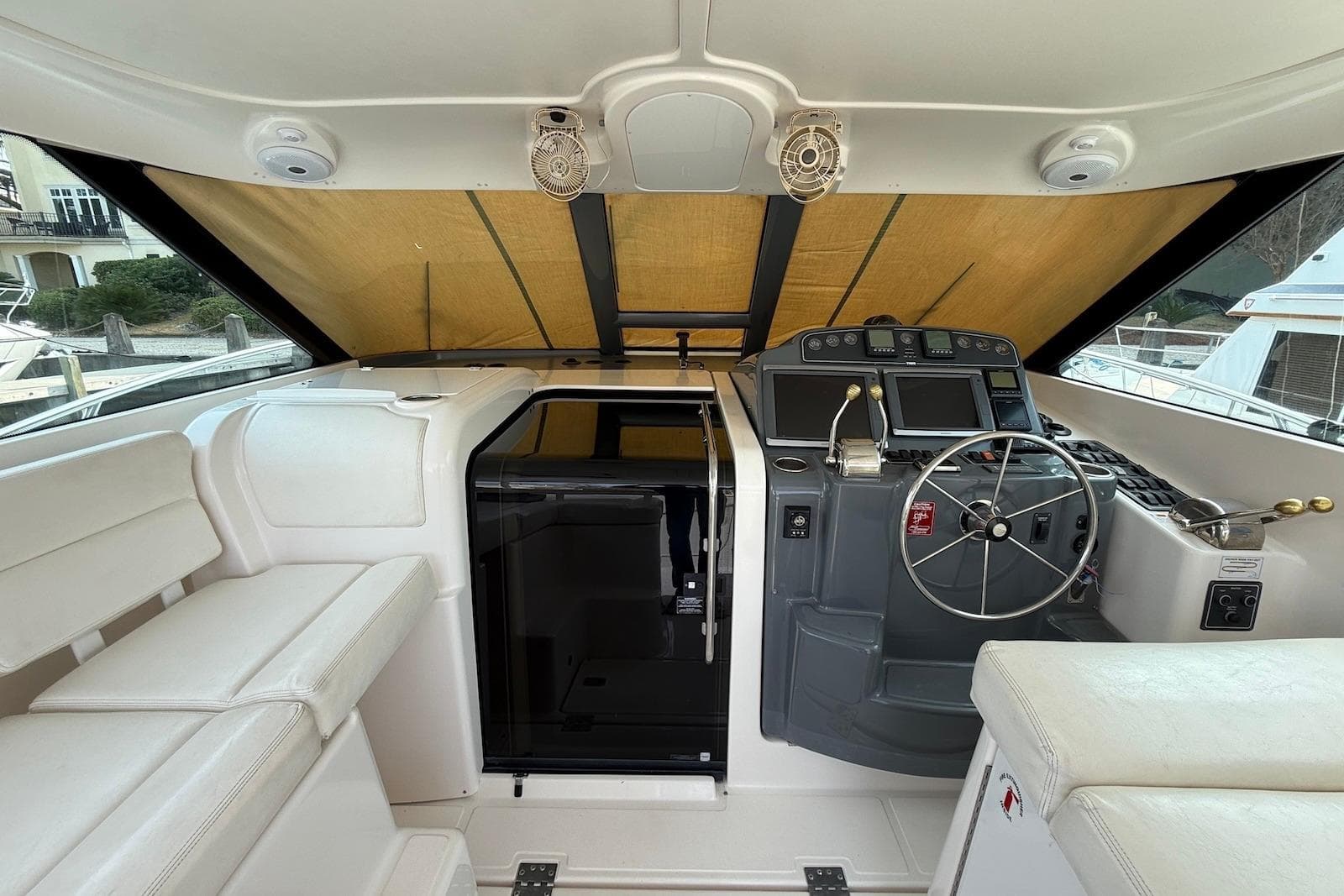 2004 Tiara Yachts 3600 Sovran helm with modern controls and comfortable seating.