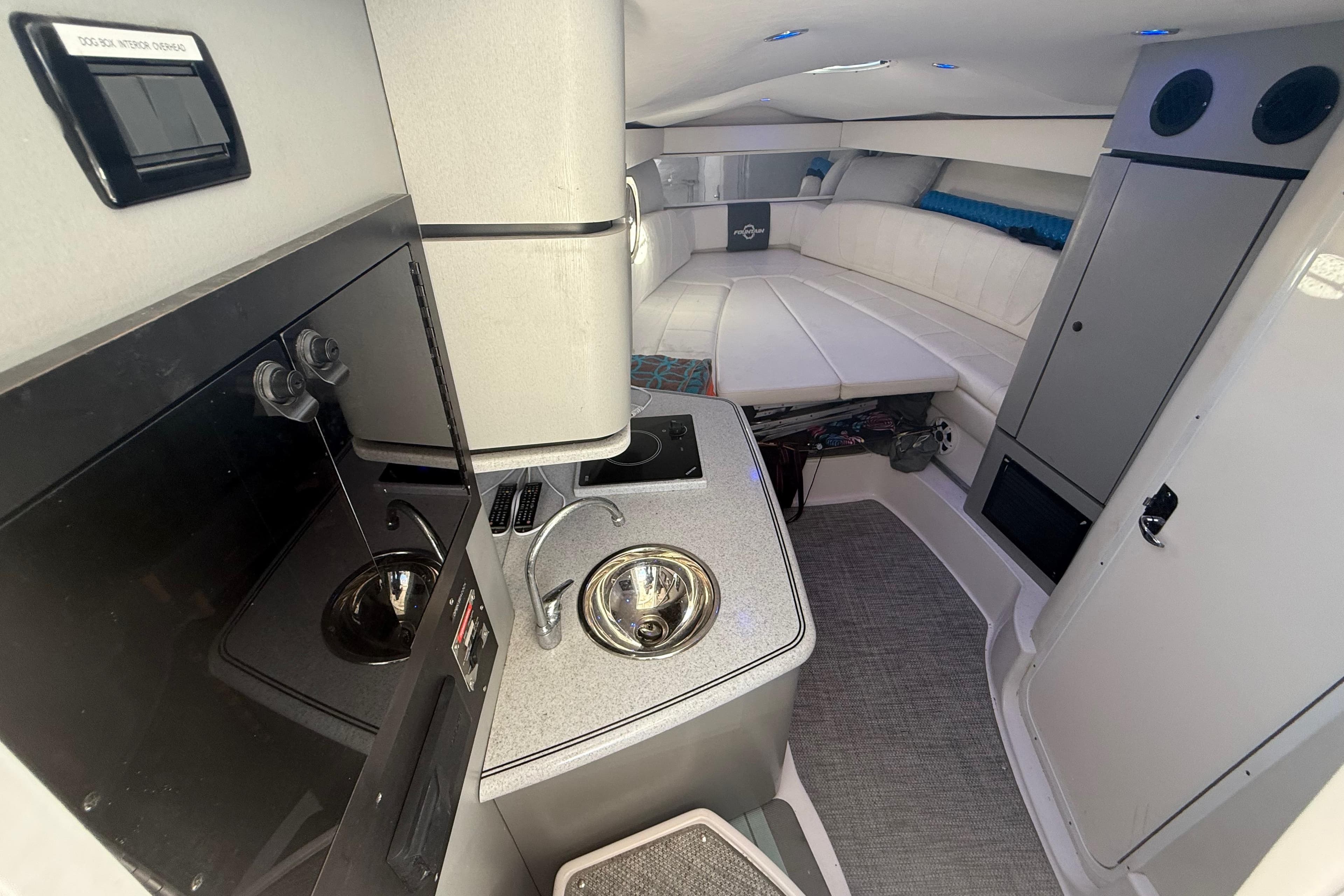 2017 Fountain 38 Sportfish Cruiser interior with kitchenette and seating area.