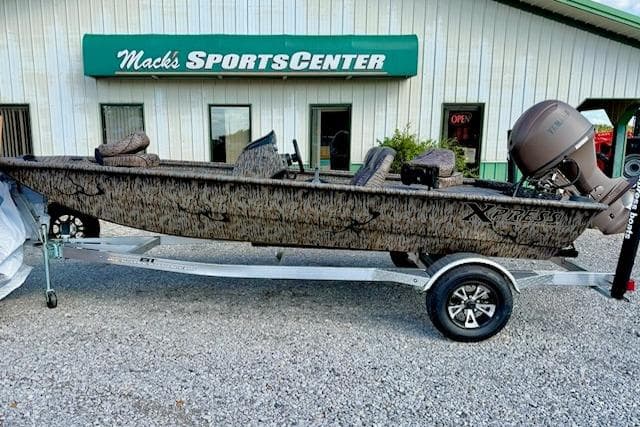 2026 Express Xp170 boat on trailer outside Mack's Sports Center.