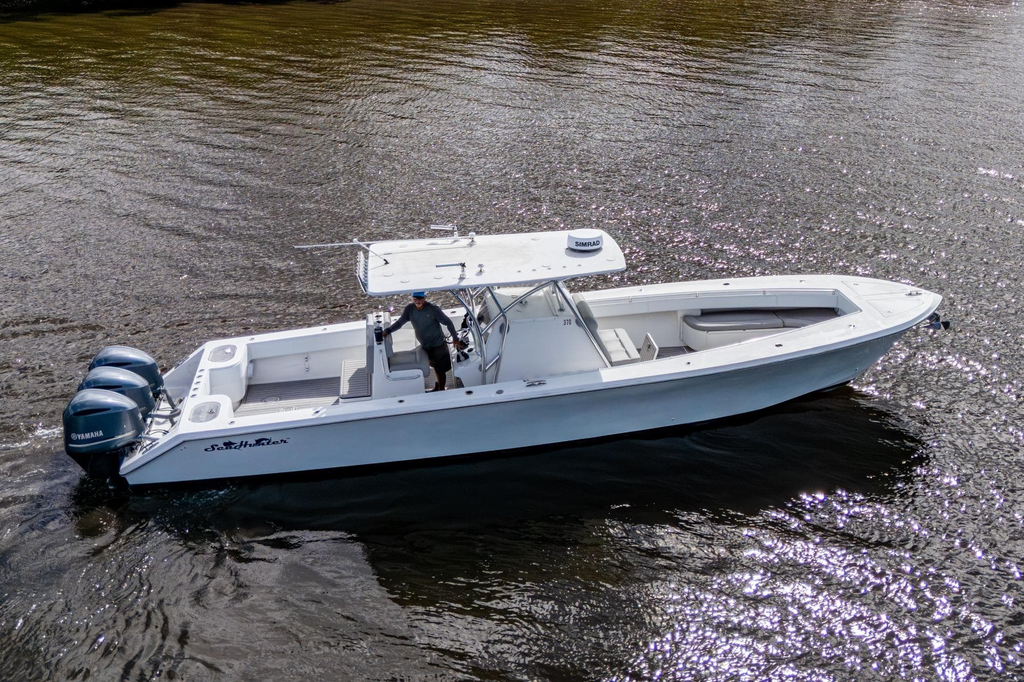 2015 SeaHunter 37 Tournament boat on water with triple Yamaha engines.