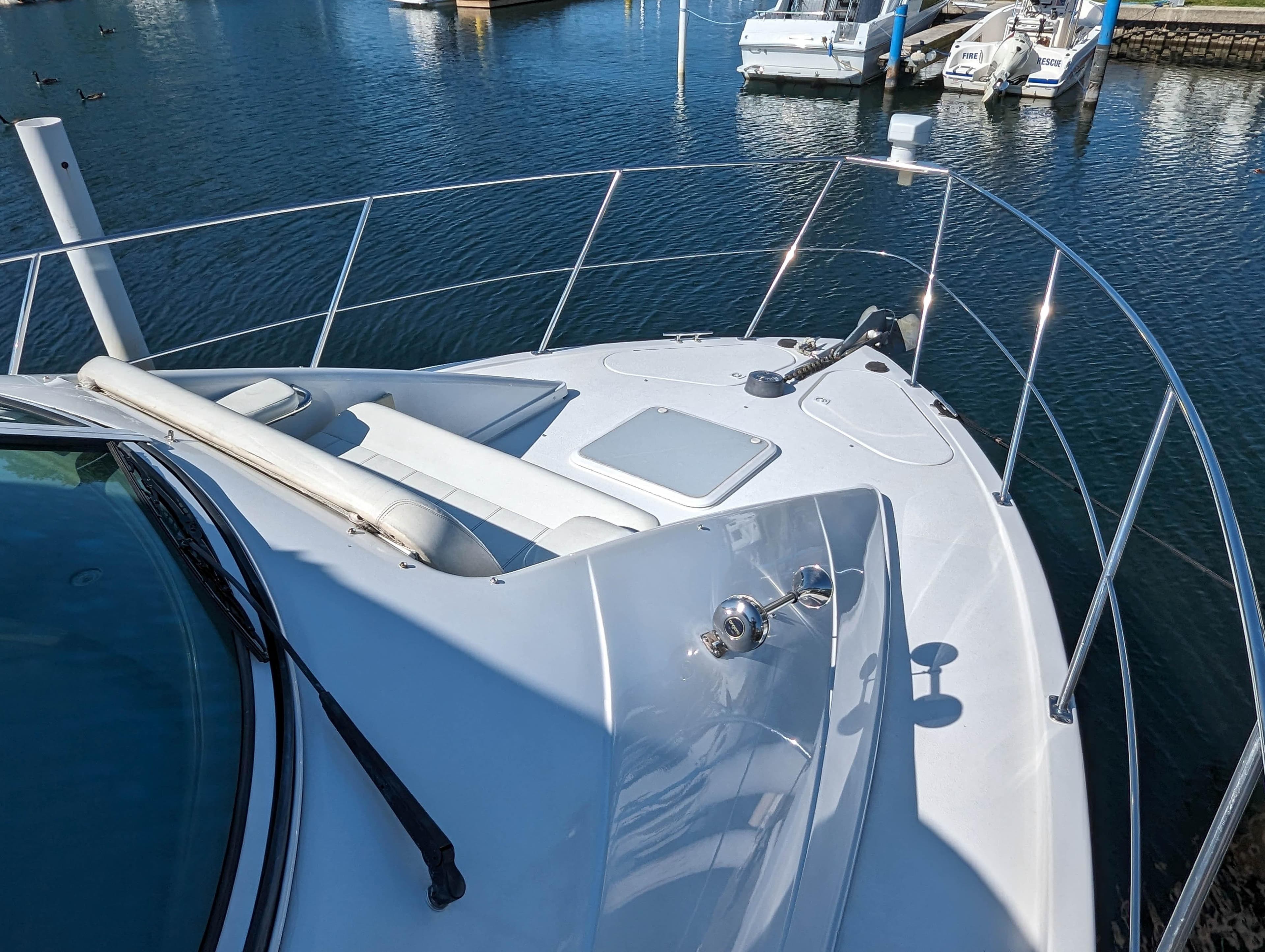 Carver 350 Mariner 2000 on calm water in harbor.