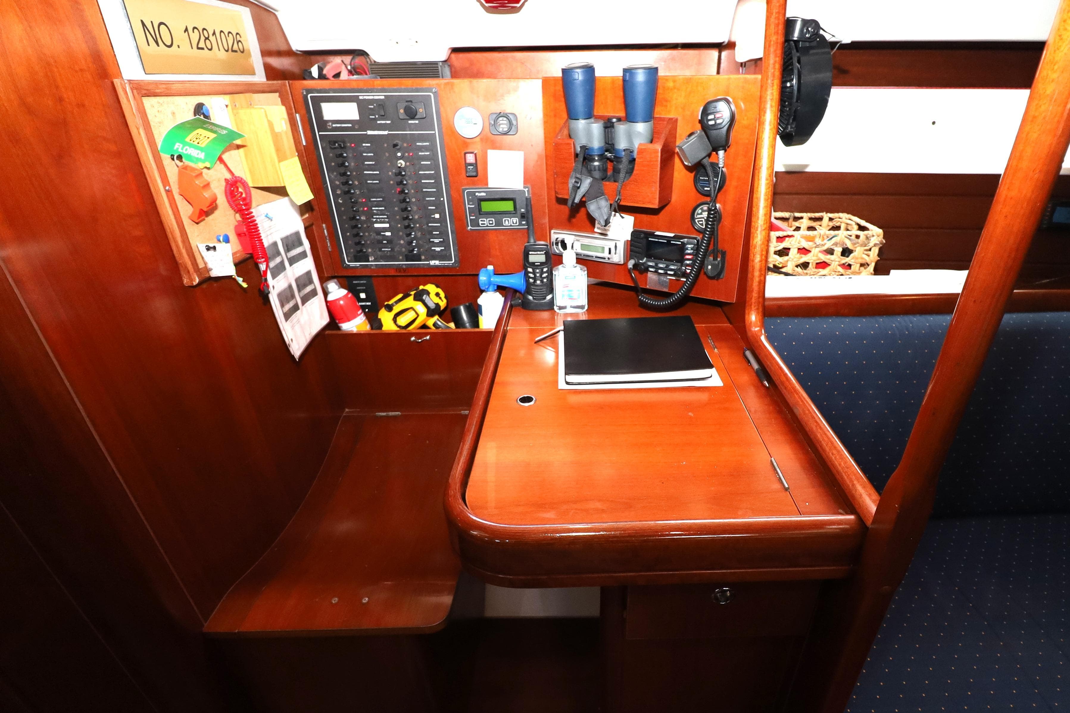Navigation station on 2005 Beneteau Oceanis Clipper 423 yacht with control panel and equipment.