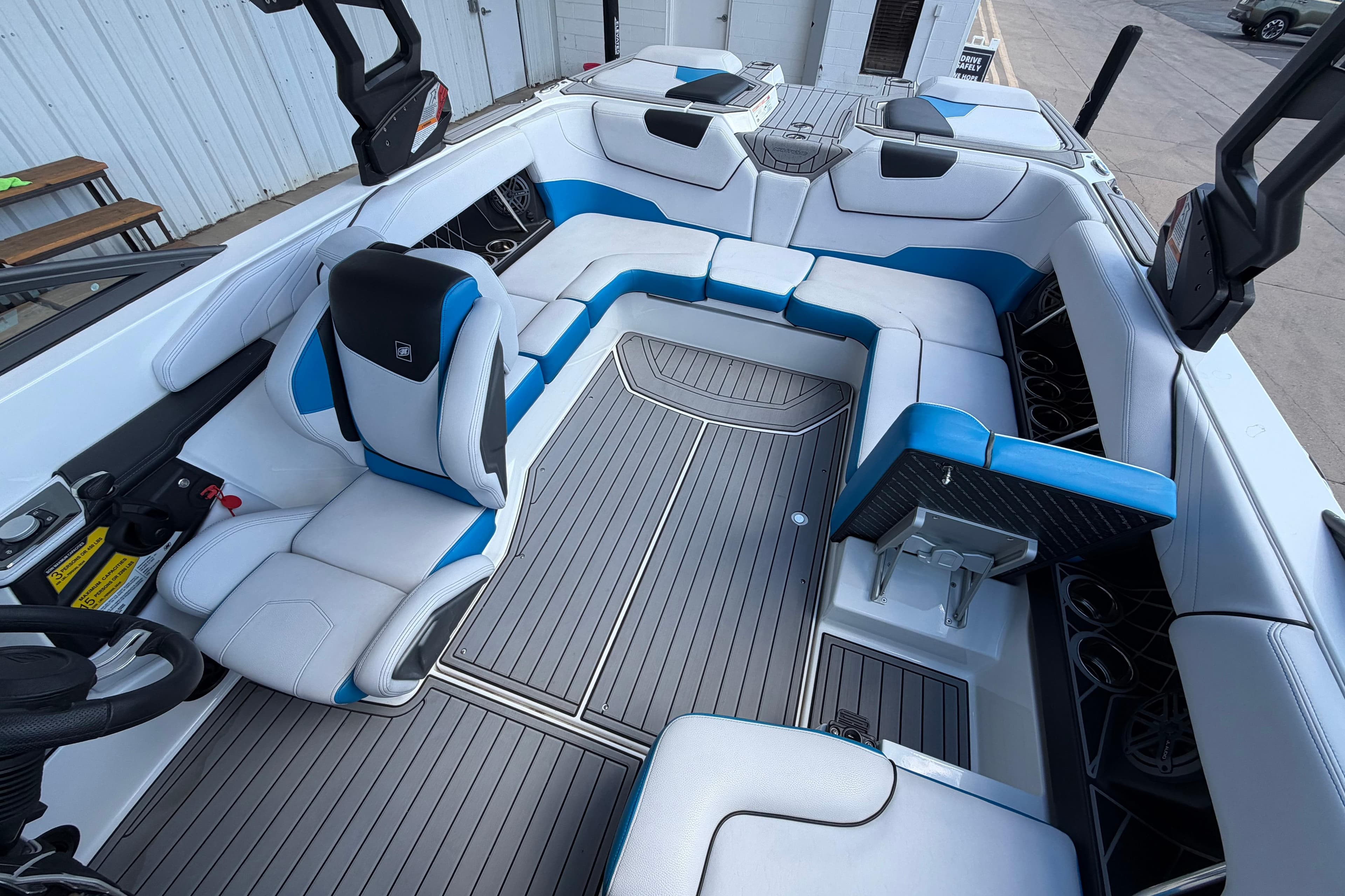 2019 Nautique Super Air Nautique GS22 interior with blue and white seating, modern design.