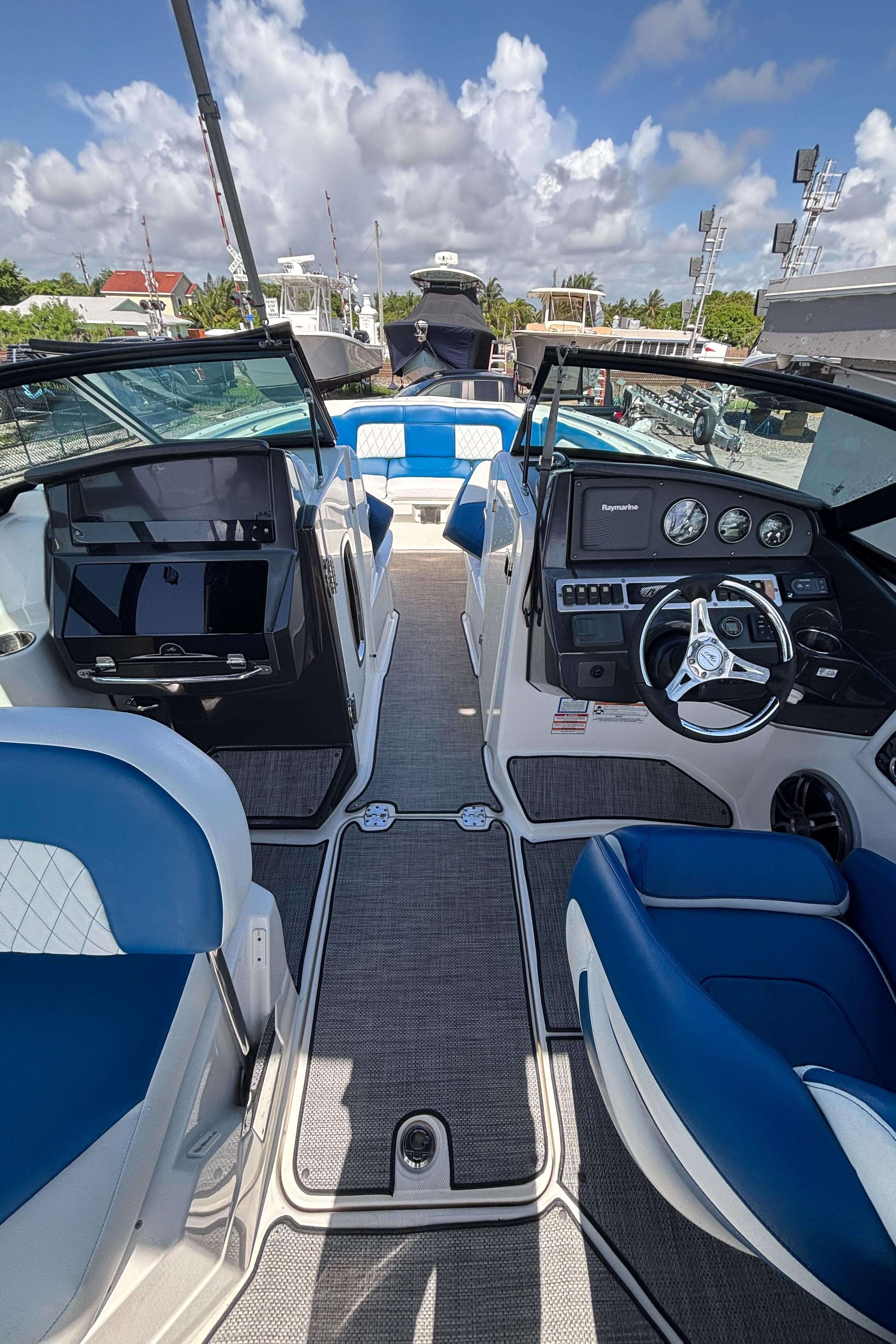 Interior of a 2017 Monterey M65 boat with blue and white seating.