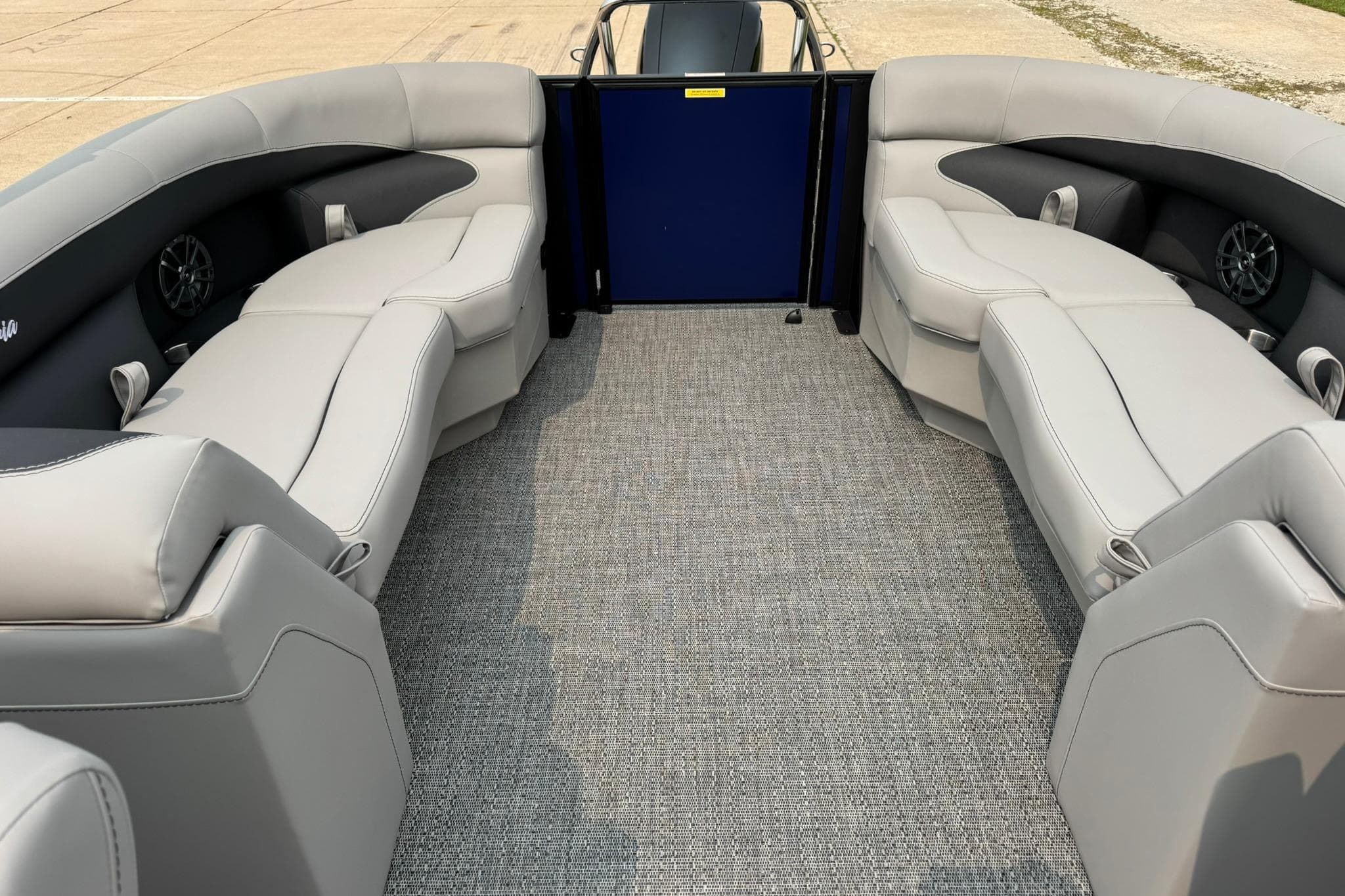 2026 Barletta ARIA 22QC pontoon boat interior with plush seating and carpeted flooring.