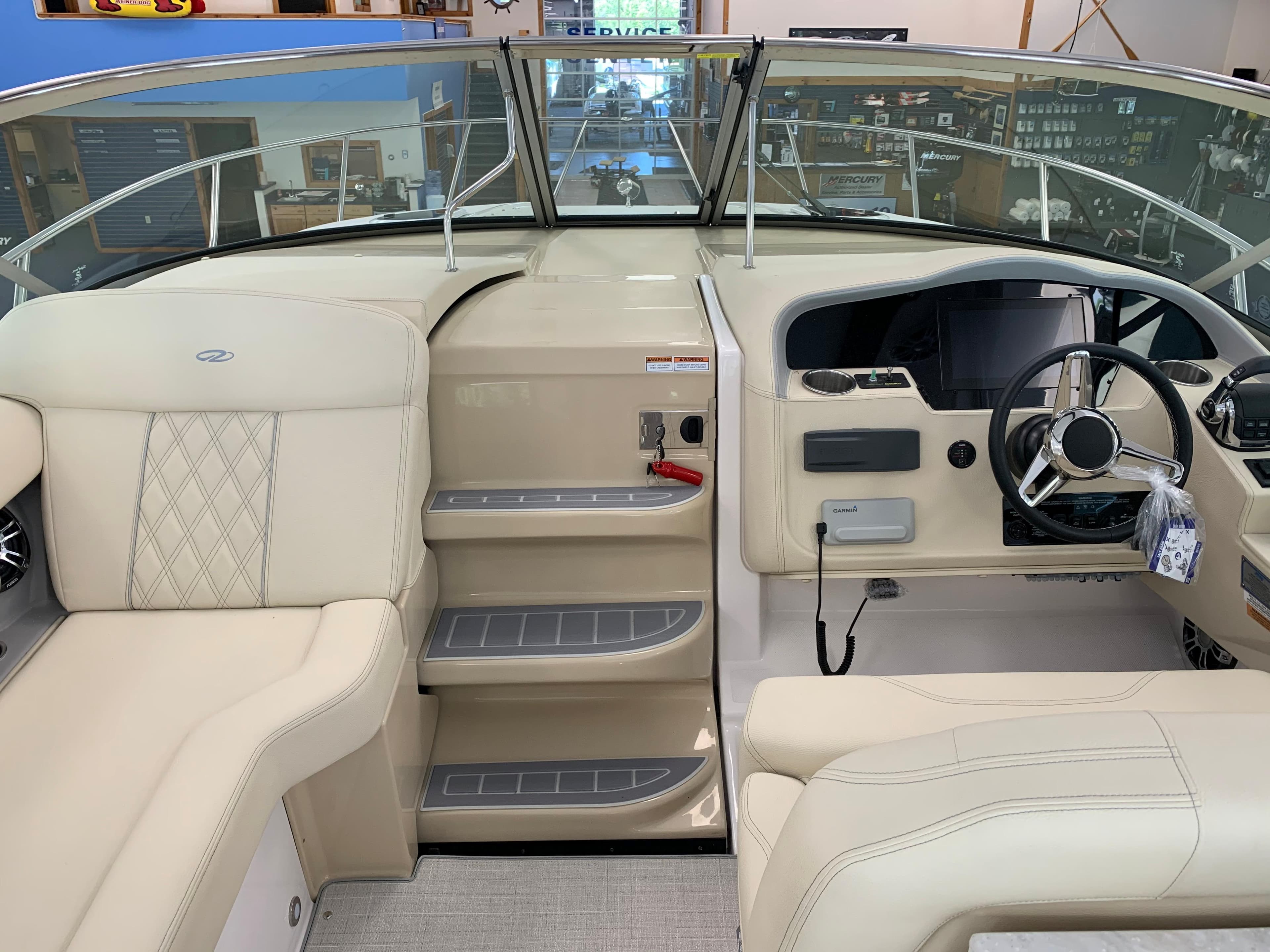 2021 Regal 33 Express boat interior with beige seating and modern helm controls.