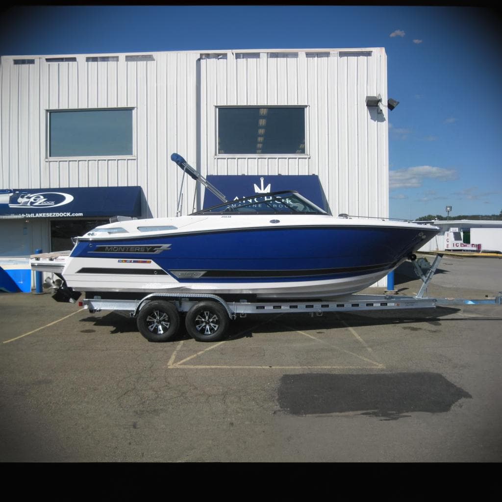 2024 Monterey 258SS Super Sport boat on trailer outside building.