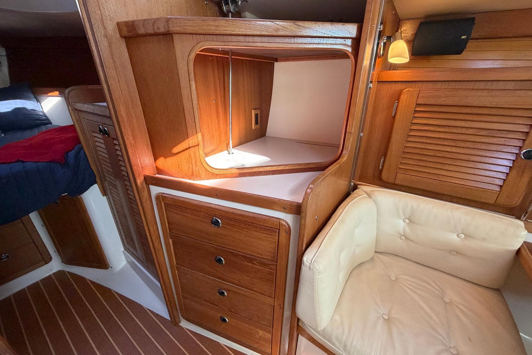 Interior of 2001 Catalina 36 MkII sailboat with wooden cabinetry and cozy seating.