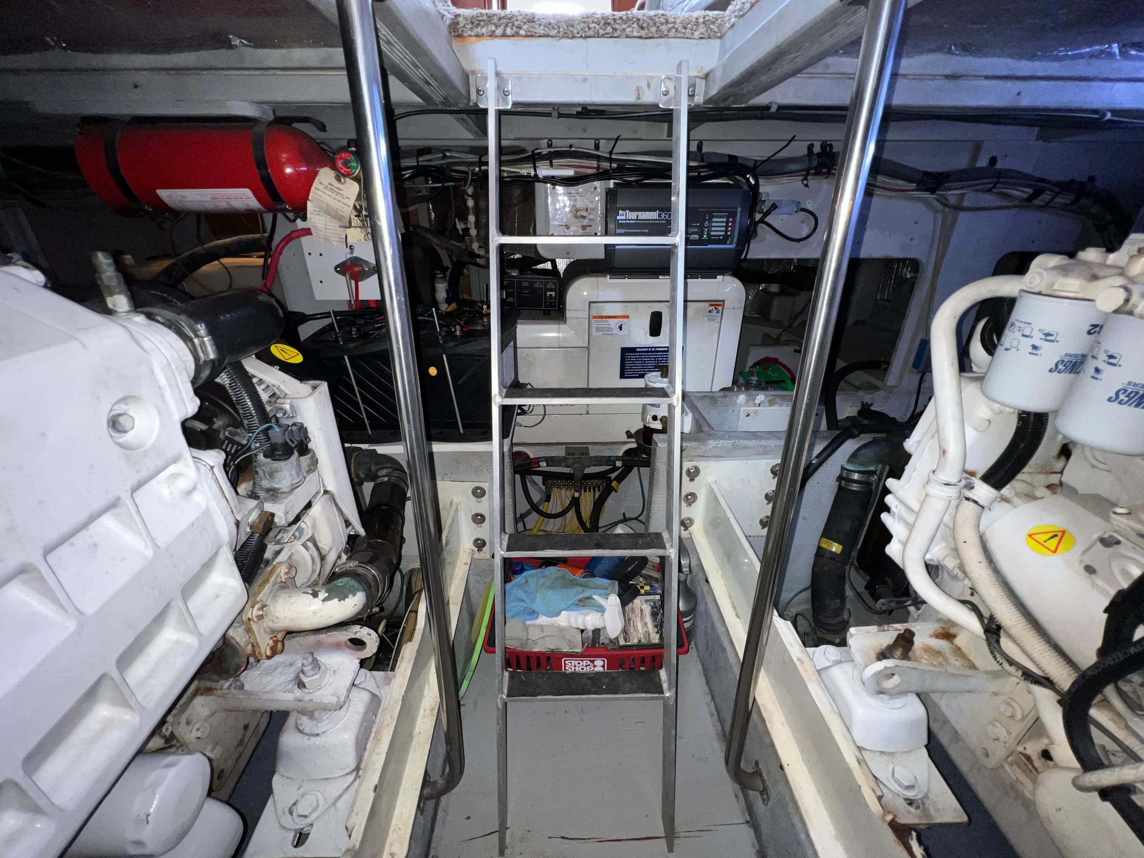 Engine room of 2004 Silverton 39 Motor Yacht with visible machinery and equipment.