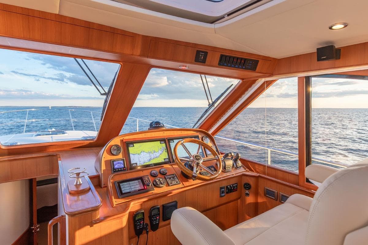 Helm of 2014 Hunt Yachts 44, featuring navigation equipment and ocean view.