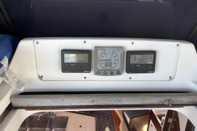 Control panel of a 2000 Hunter 340 sailboat with navigation instruments.