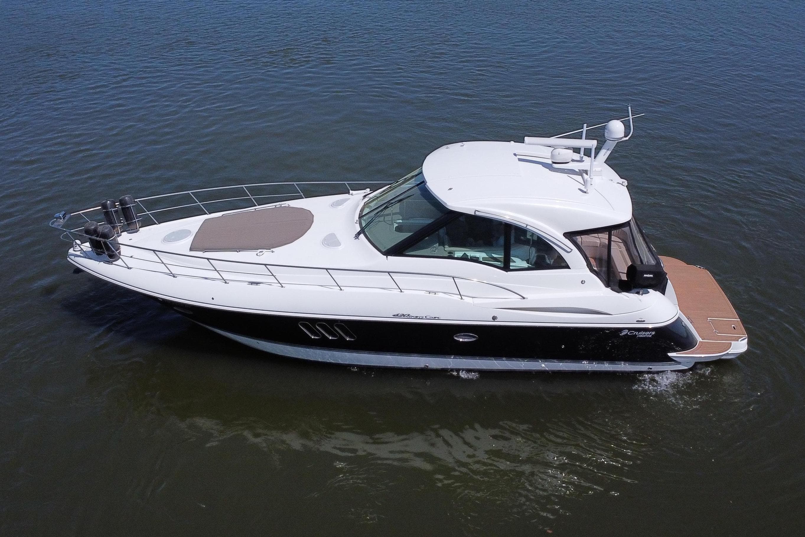 2009 Cruisers Yachts 420 Sports Coupe on calm water, aerial view.