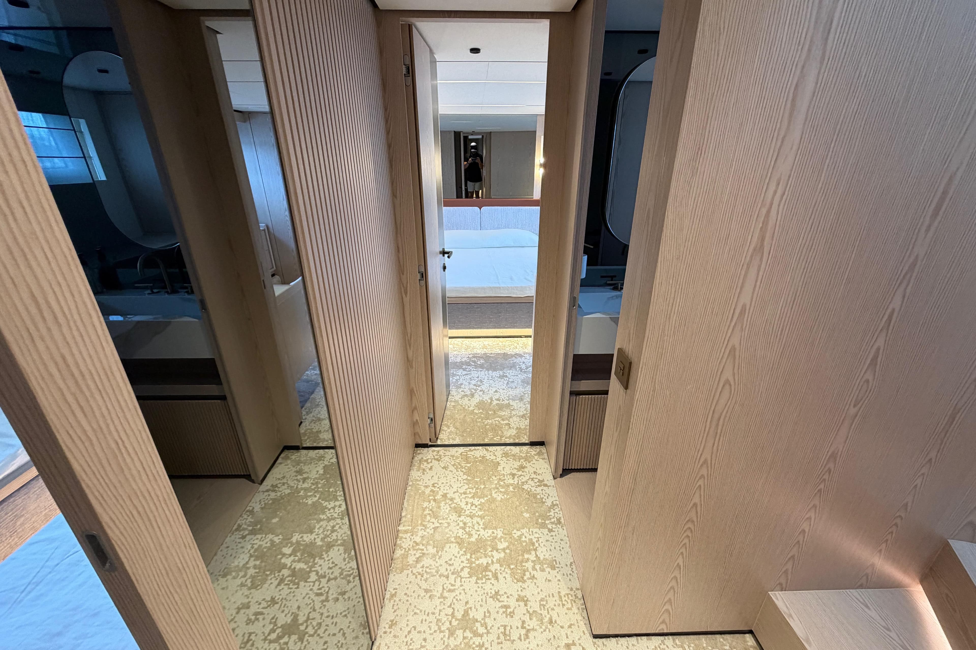 Luxurious interior of 2028 Solaris Power 70 Long Range yacht, featuring modern wood paneling.