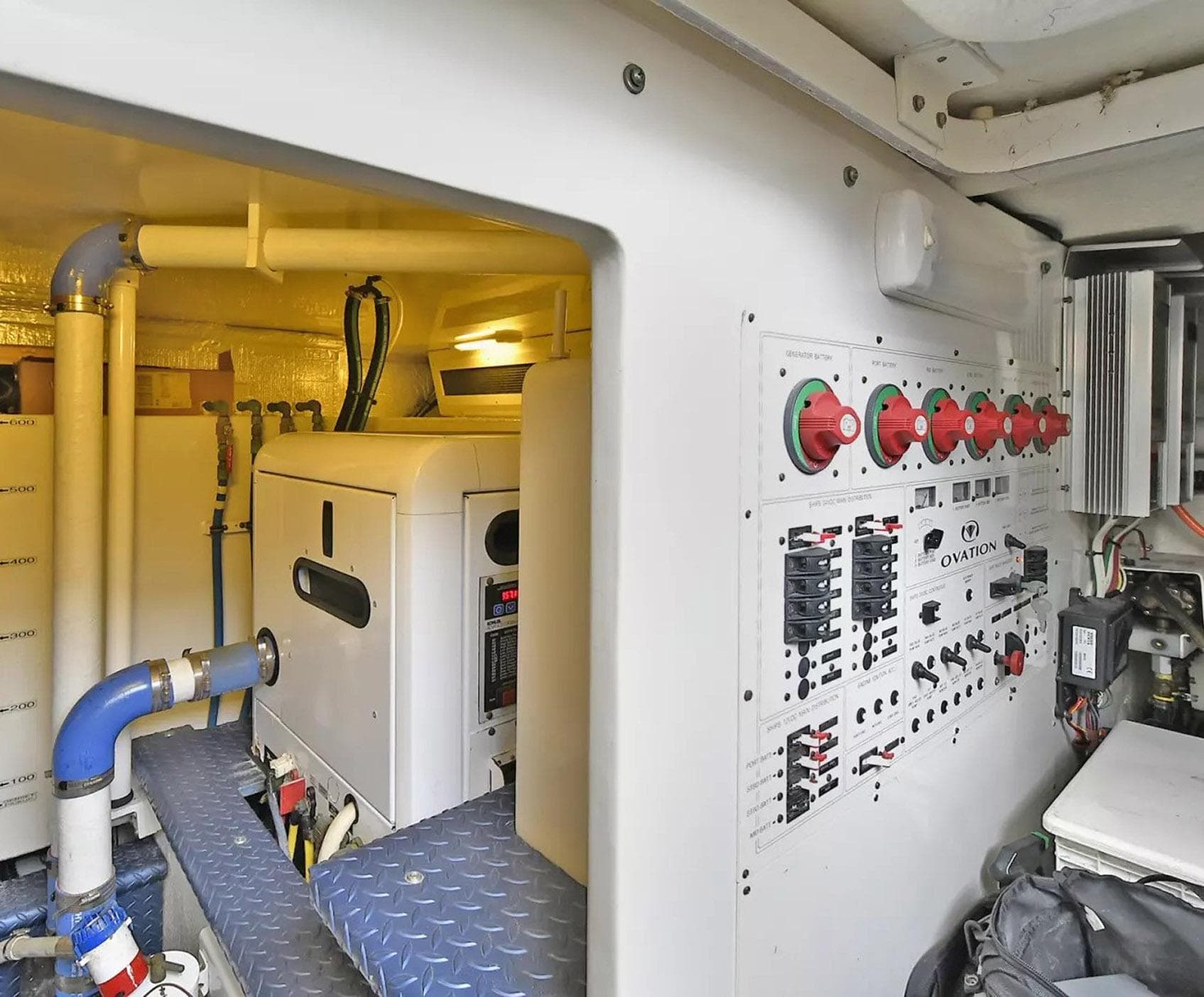 Engine room of 2009 Silverton 52 Ovation yacht with control panels and machinery.