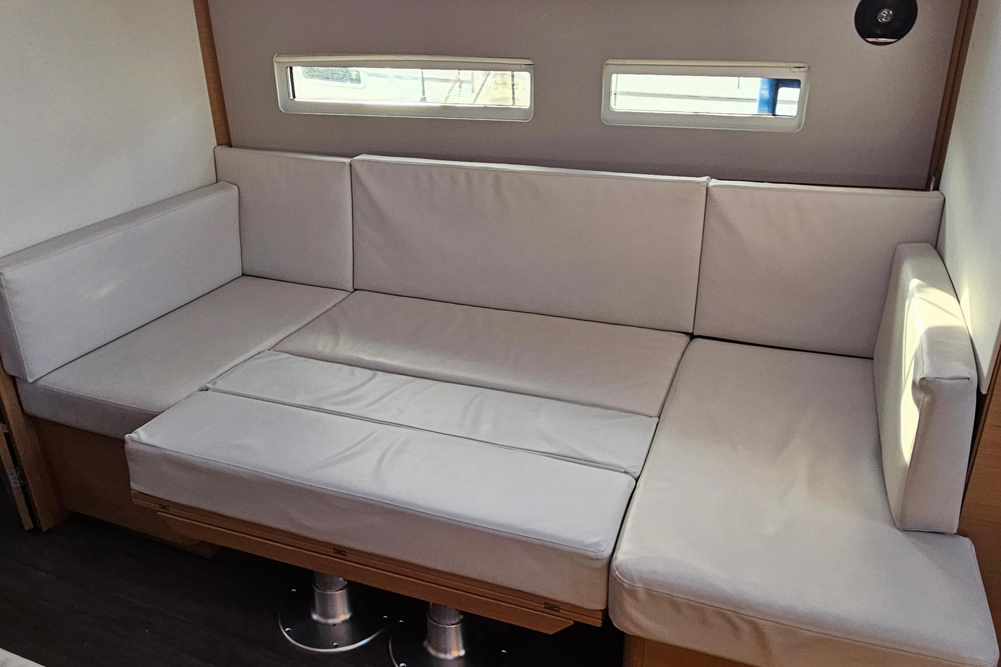 Interior seating area of 2019 Jeanneau Sun Odyssey 410 sailboat.