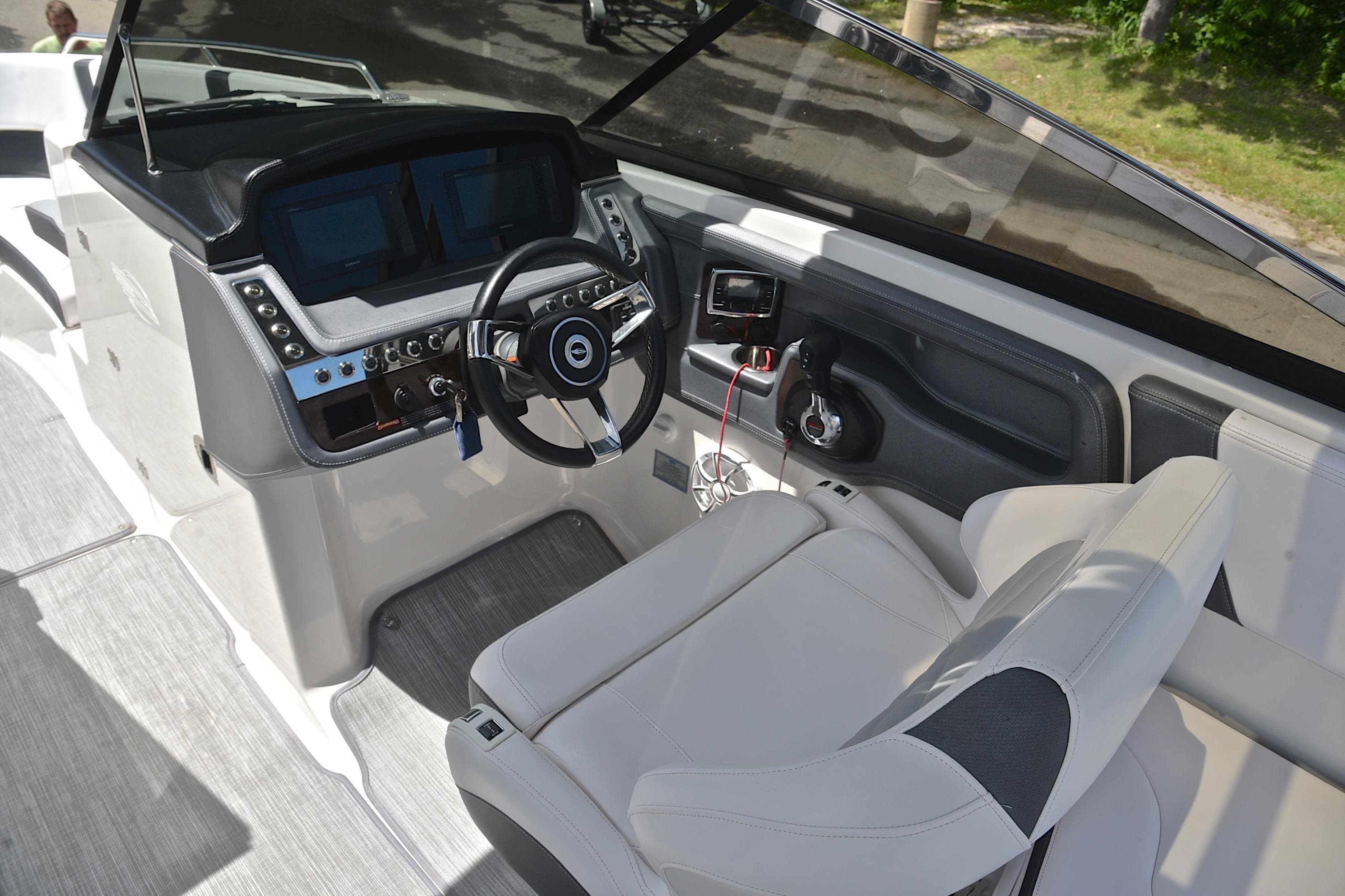Interior cockpit of 2018 Chaparral 287 SSX boat with modern steering and controls.