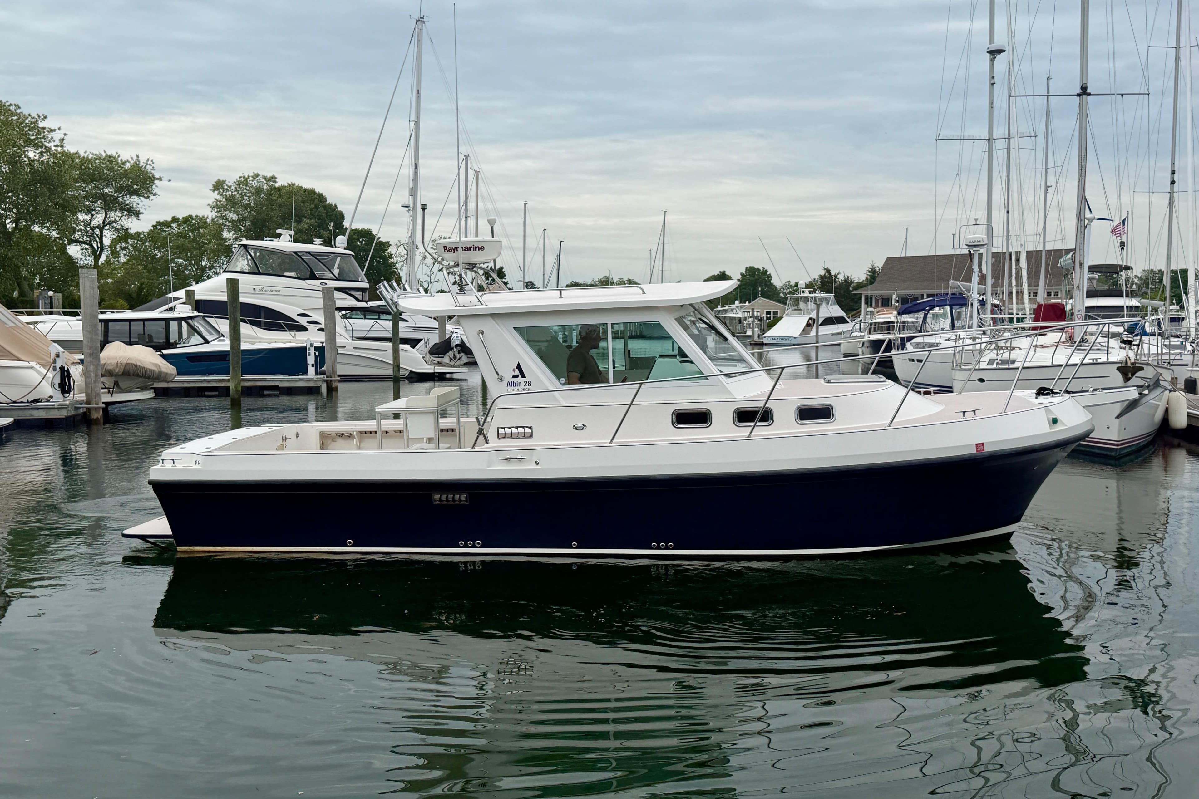 2006 Albin 28 Tournament Express boat docked in a marina.