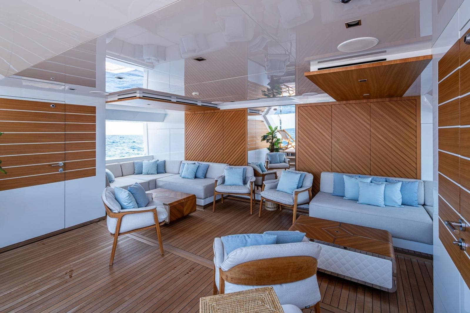 Luxurious interior of 2020 Overmarine Gransport 54 yacht with elegant seating and wood accents.