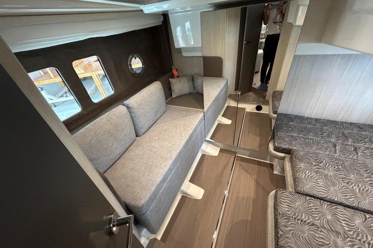 Interior of 2025 Cranchi M44HT yacht with modern seating and stylish design.