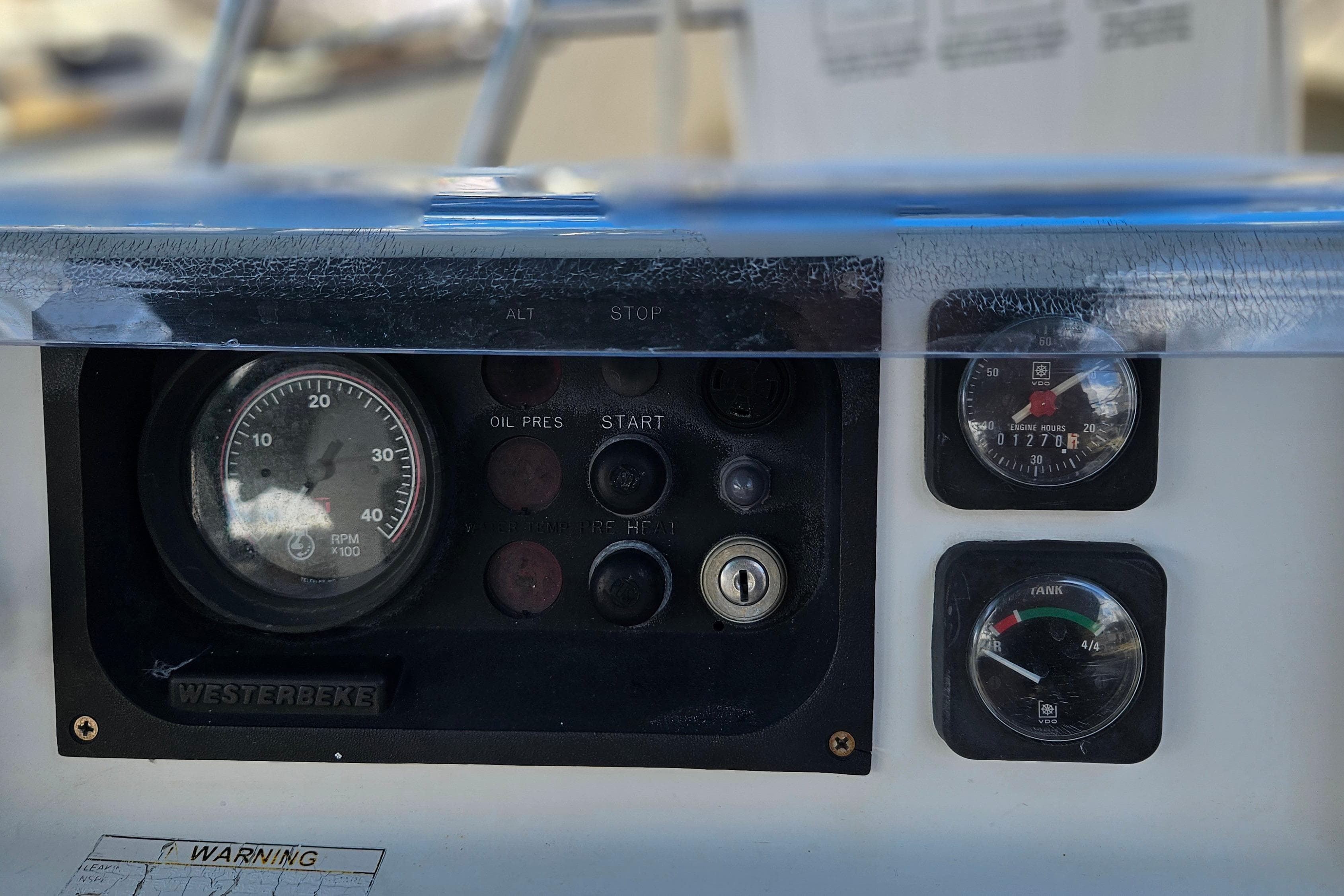 Control panel of a 2000 Beneteau Oceanis Clipper 361 sailboat, featuring gauges and switches.