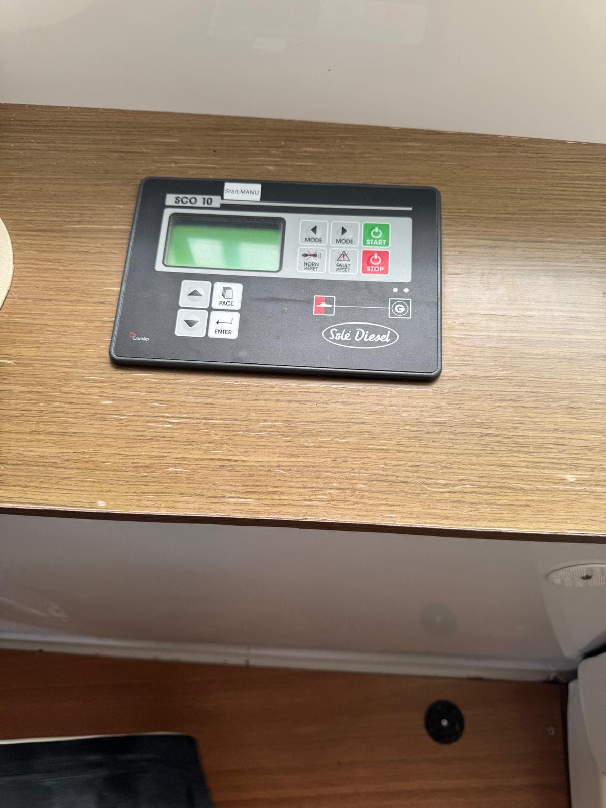 Control panel on Lagoon 50 yacht, 2018 model, featuring digital display and buttons.