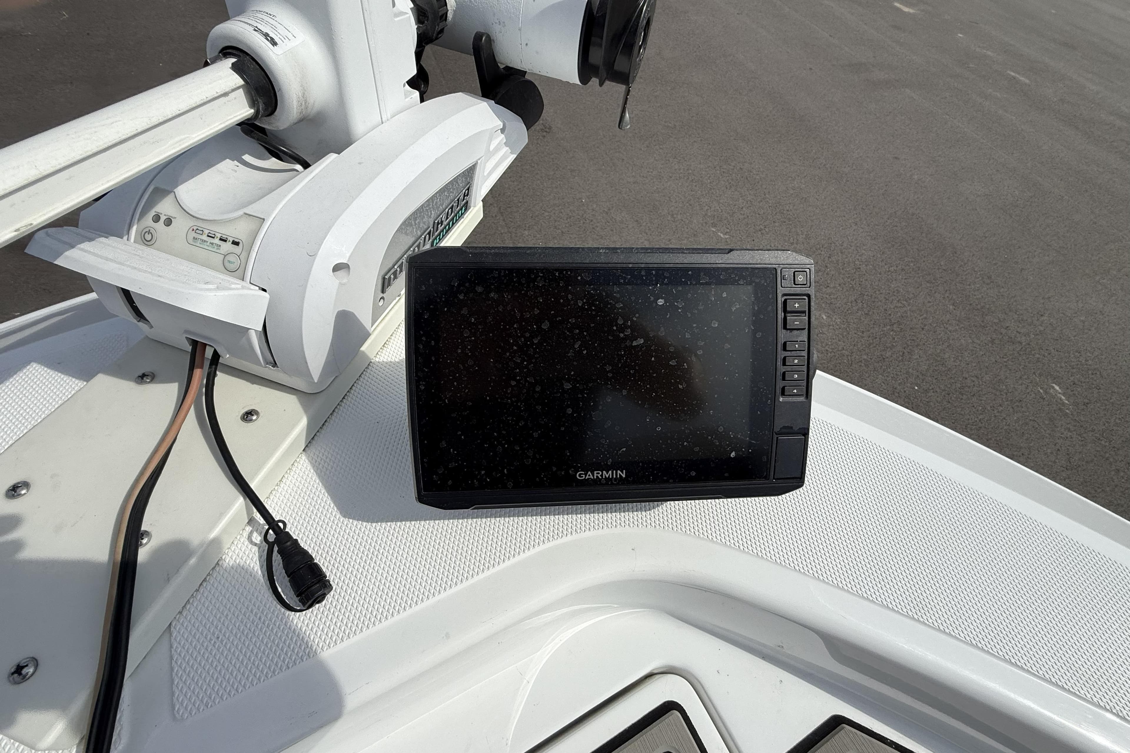 Garmin device on 2019 Wellcraft 221 Bay boat dashboard, near trolling motor.