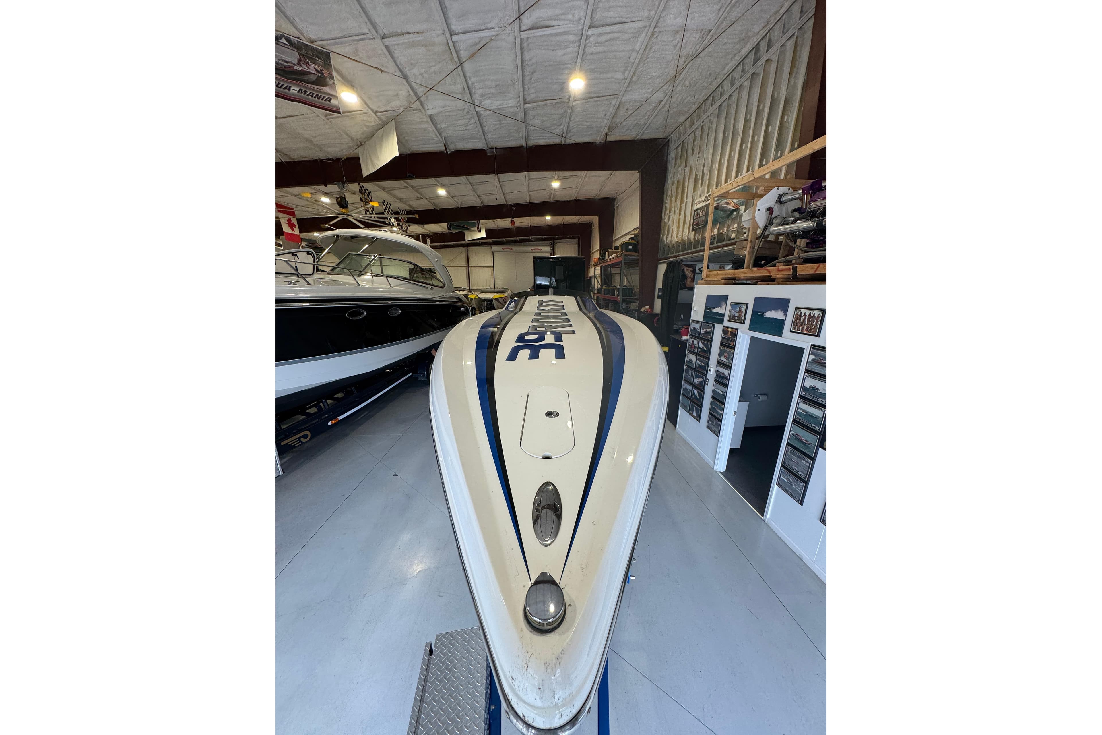 2016 Hustler 39 boat in a spacious indoor storage facility.