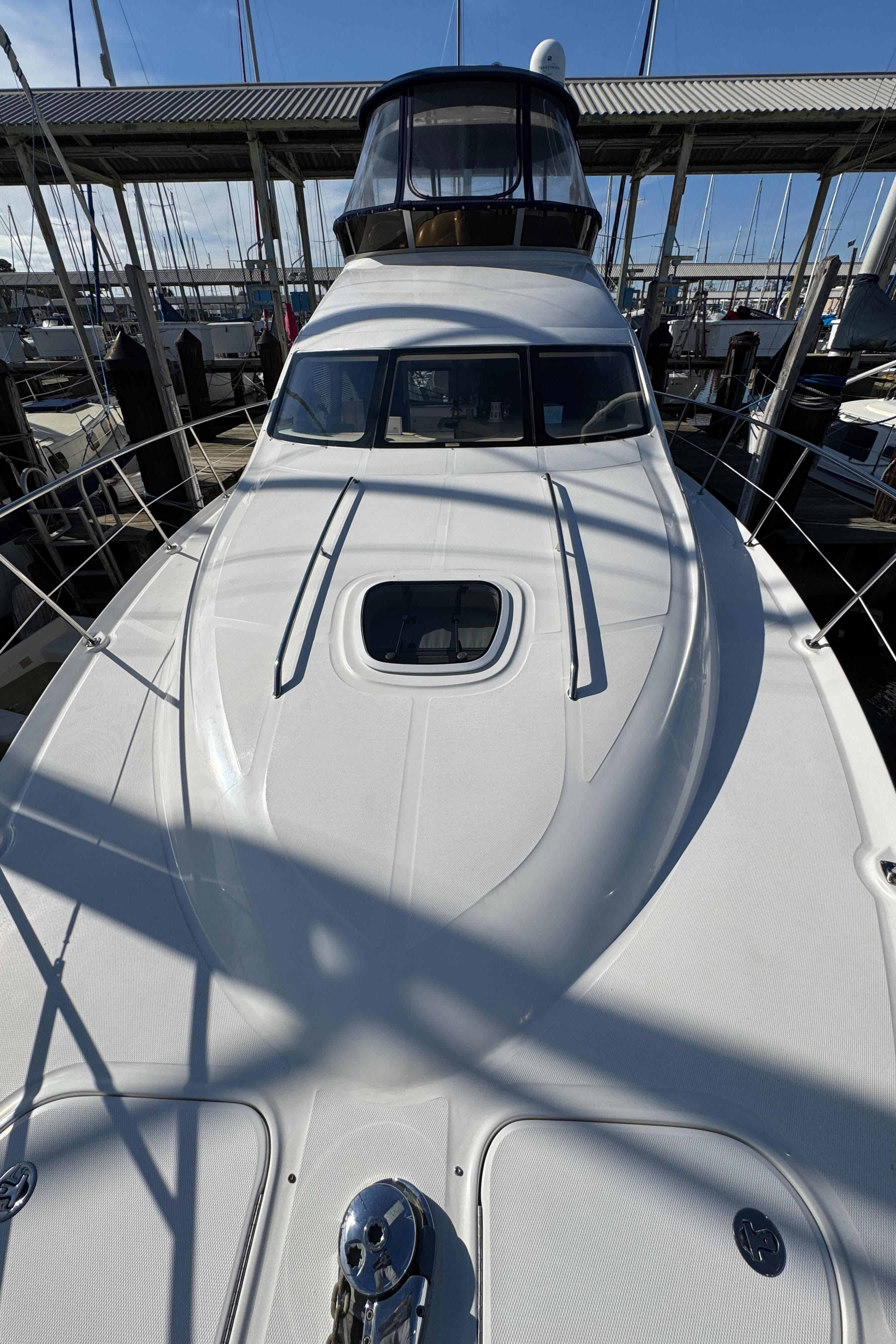 2007 Sea Ray 44 Sedan Bridge yacht docked at marina.