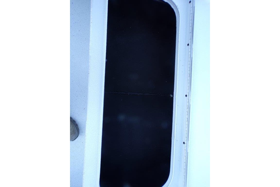 2026 Xpress H20B Bay boat deck with black hatch cover.