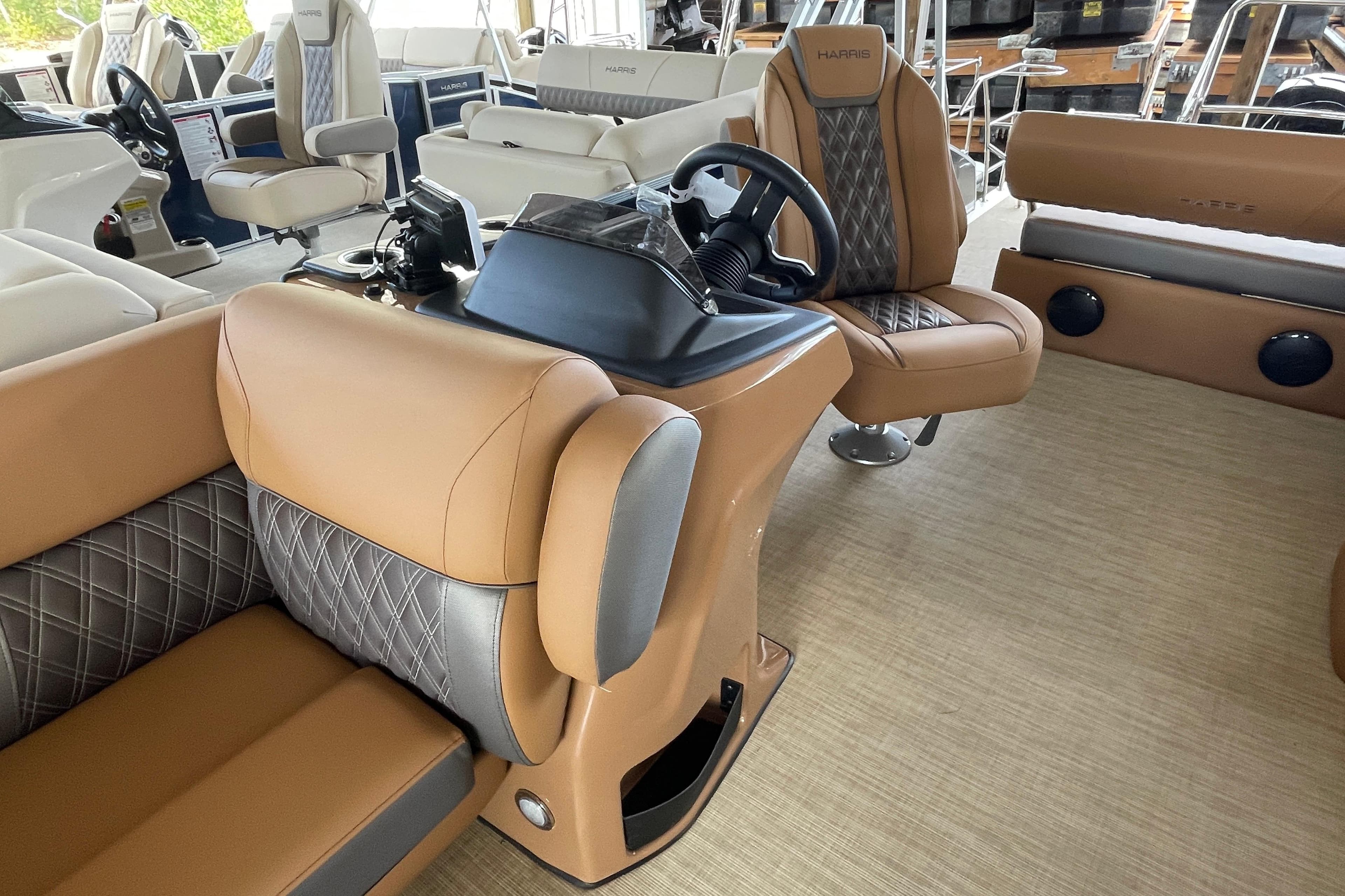 2026 Harris Cruiser 210 interior with luxurious tan and gray seating.