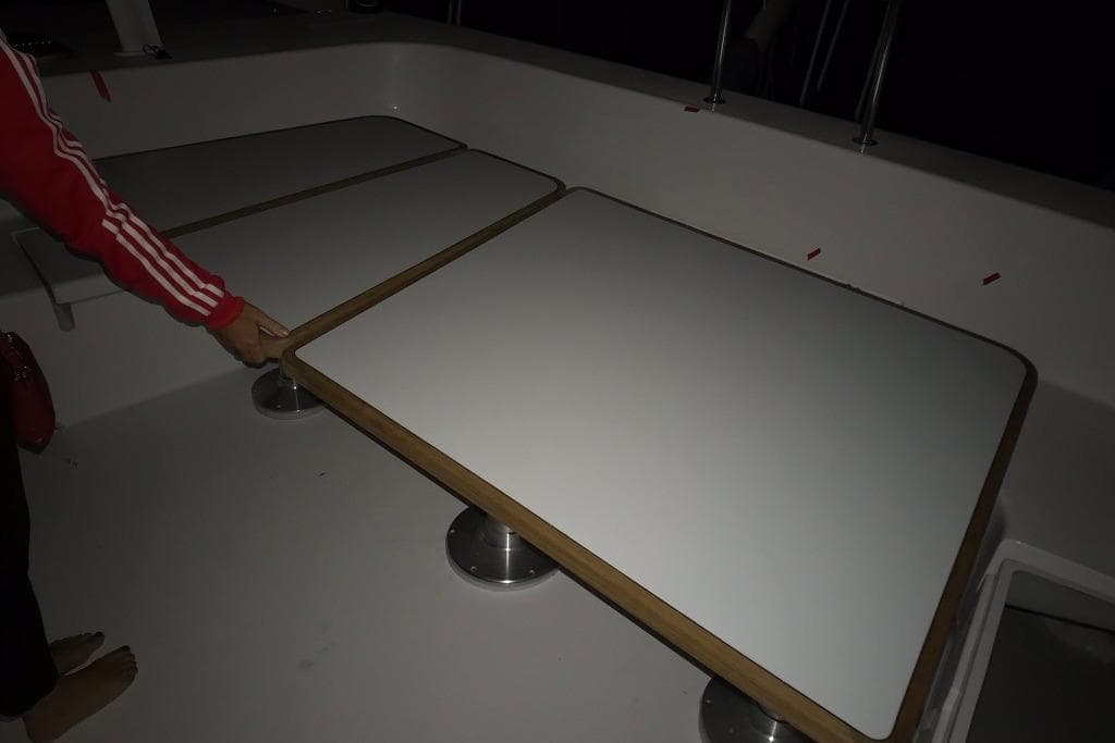 2018 Outremer 51 yacht interior with adjustable tables and seating area.