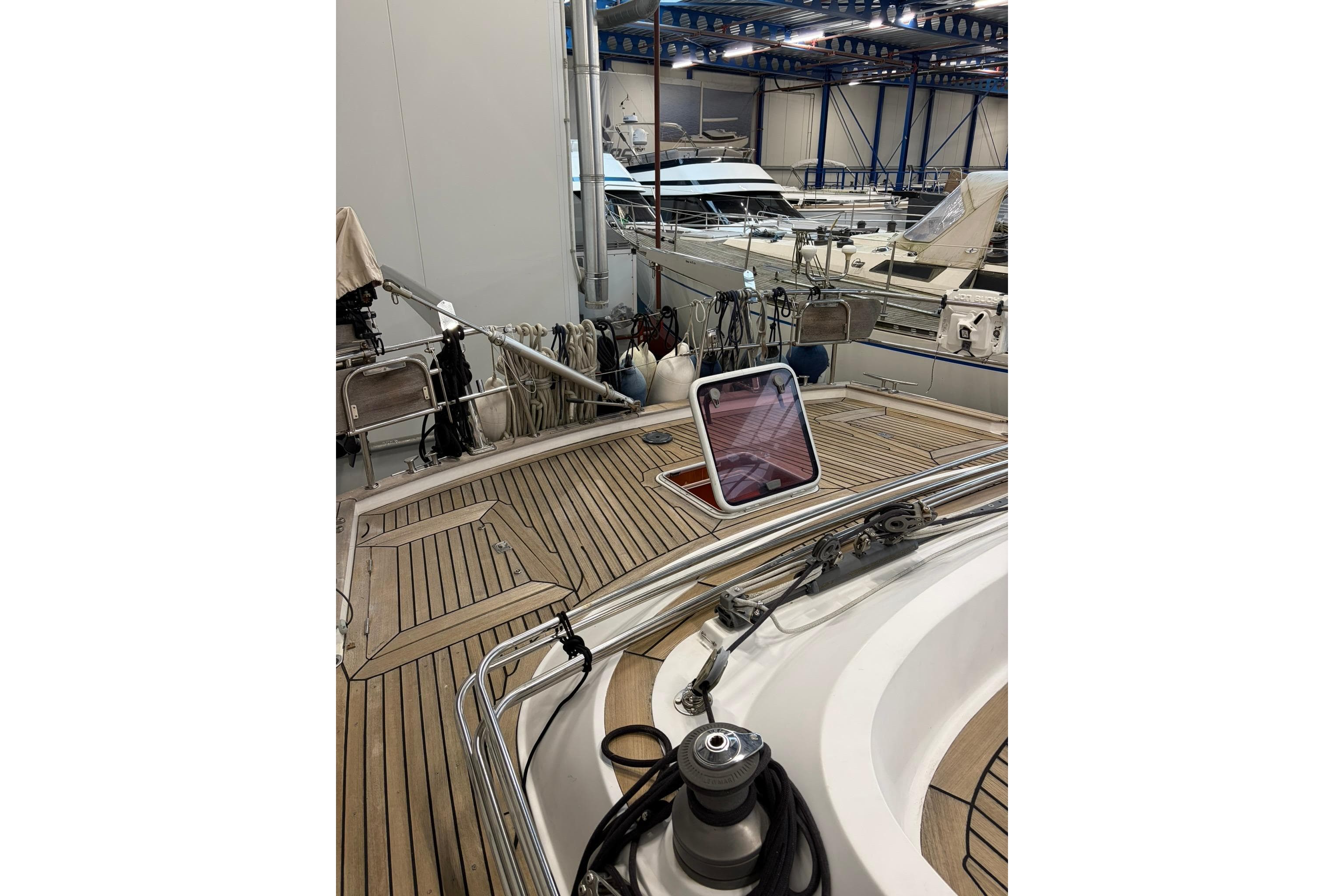 2006 Contest 50CS yacht interior with wooden deck in a marina setting.