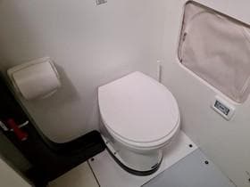 Elliott 57 yacht bathroom with toilet and window, 2011 Offshore Racing model.