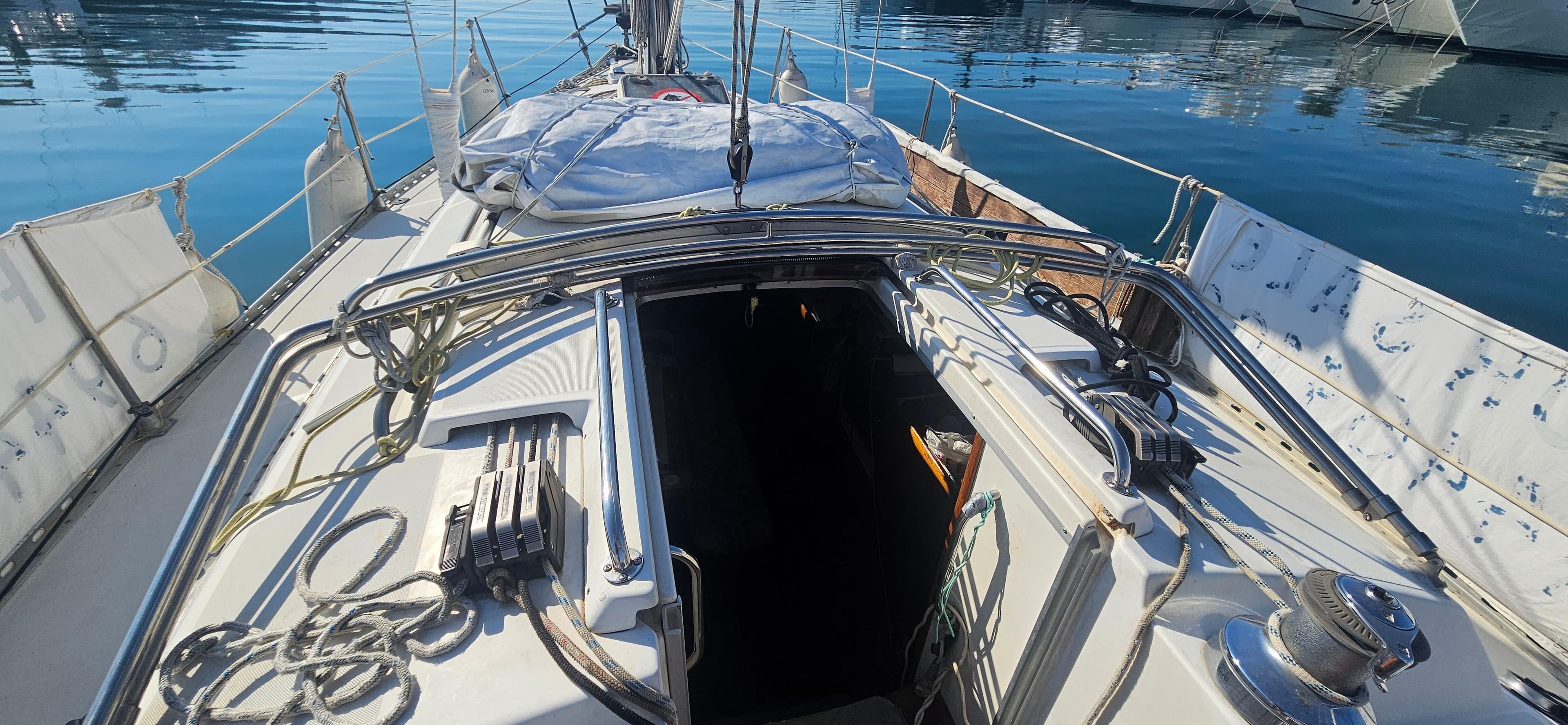 1996 Gib'Sea 334 sailboat deck with open cabin, docked at marina.