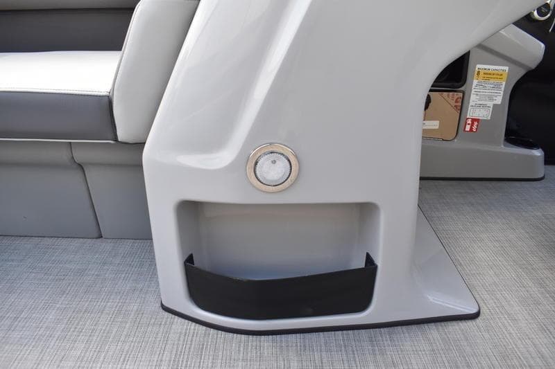 2026 Lowe LS 170 boat interior detail with gray seating and storage compartment.