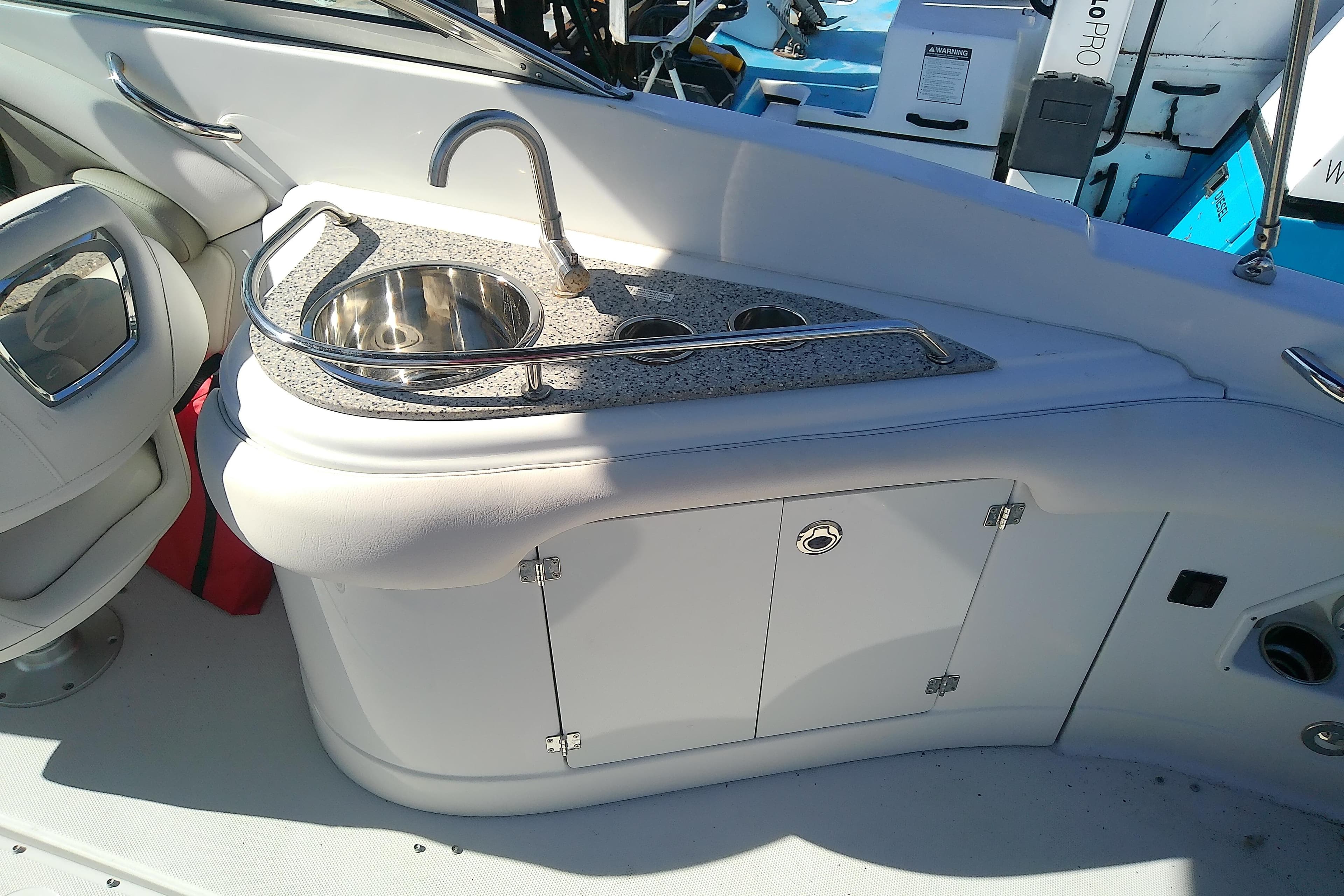 2017 Crownline Eclipse E6 XS boat interior with sink and storage area.