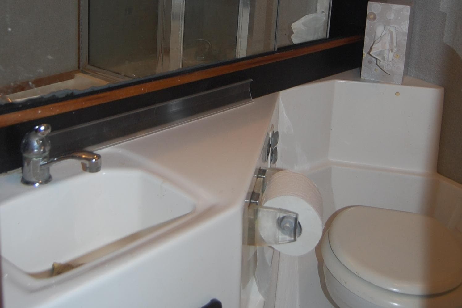 Bathroom interior of 1992 Bayliner 4588 Pilothouse MY yacht, featuring sink and toilet.