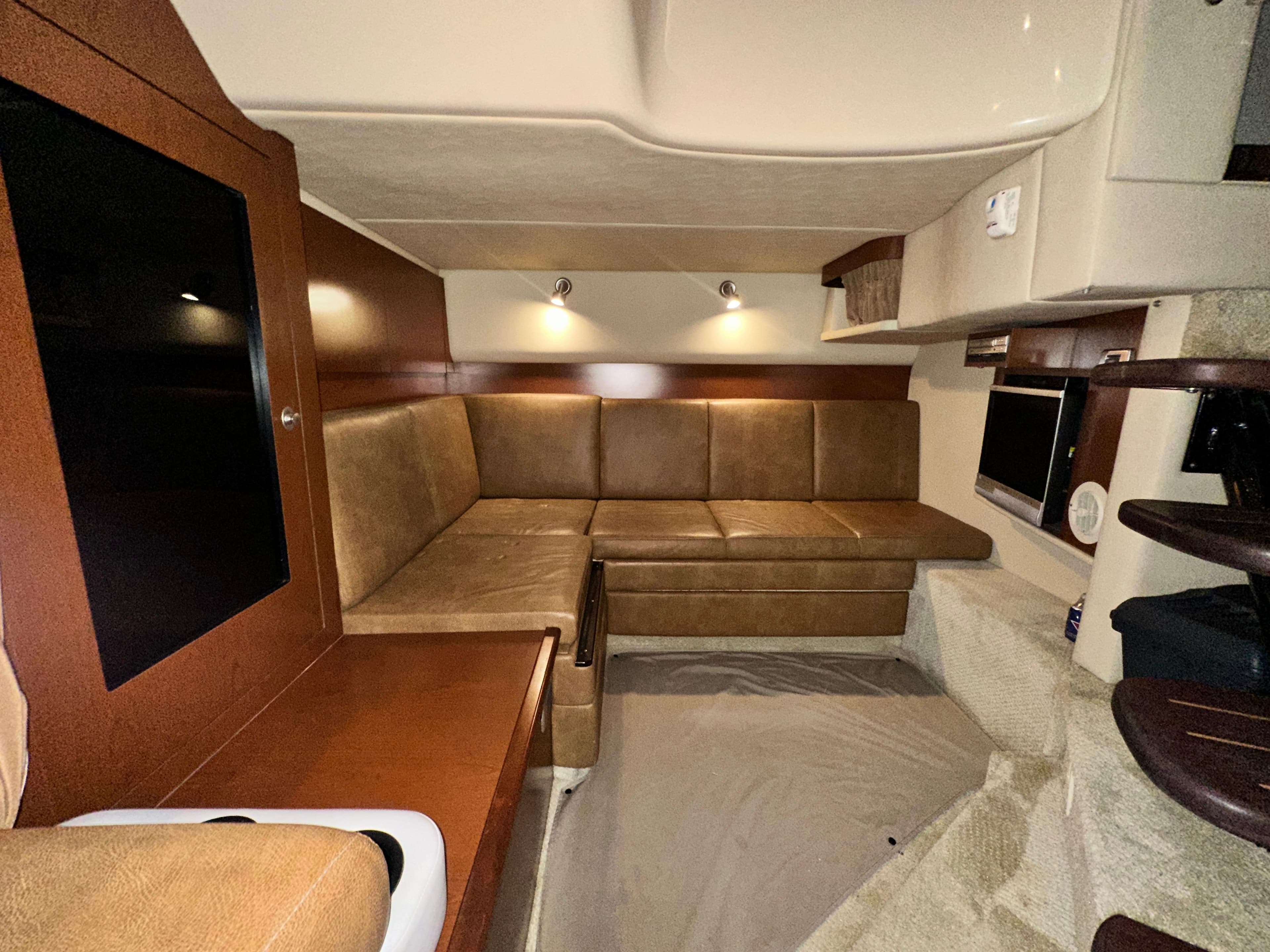 Interior of 2007 Sea Ray 380 Sundancer with leather seating and modern amenities.