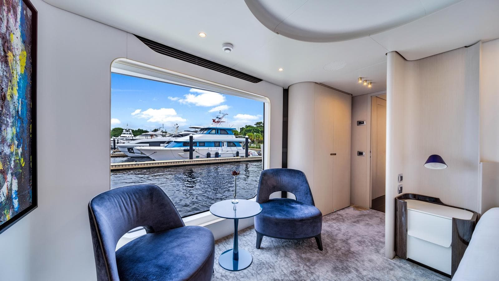 Luxurious interior of 2020 Azimut Grande 32 Metri yacht with marina view.